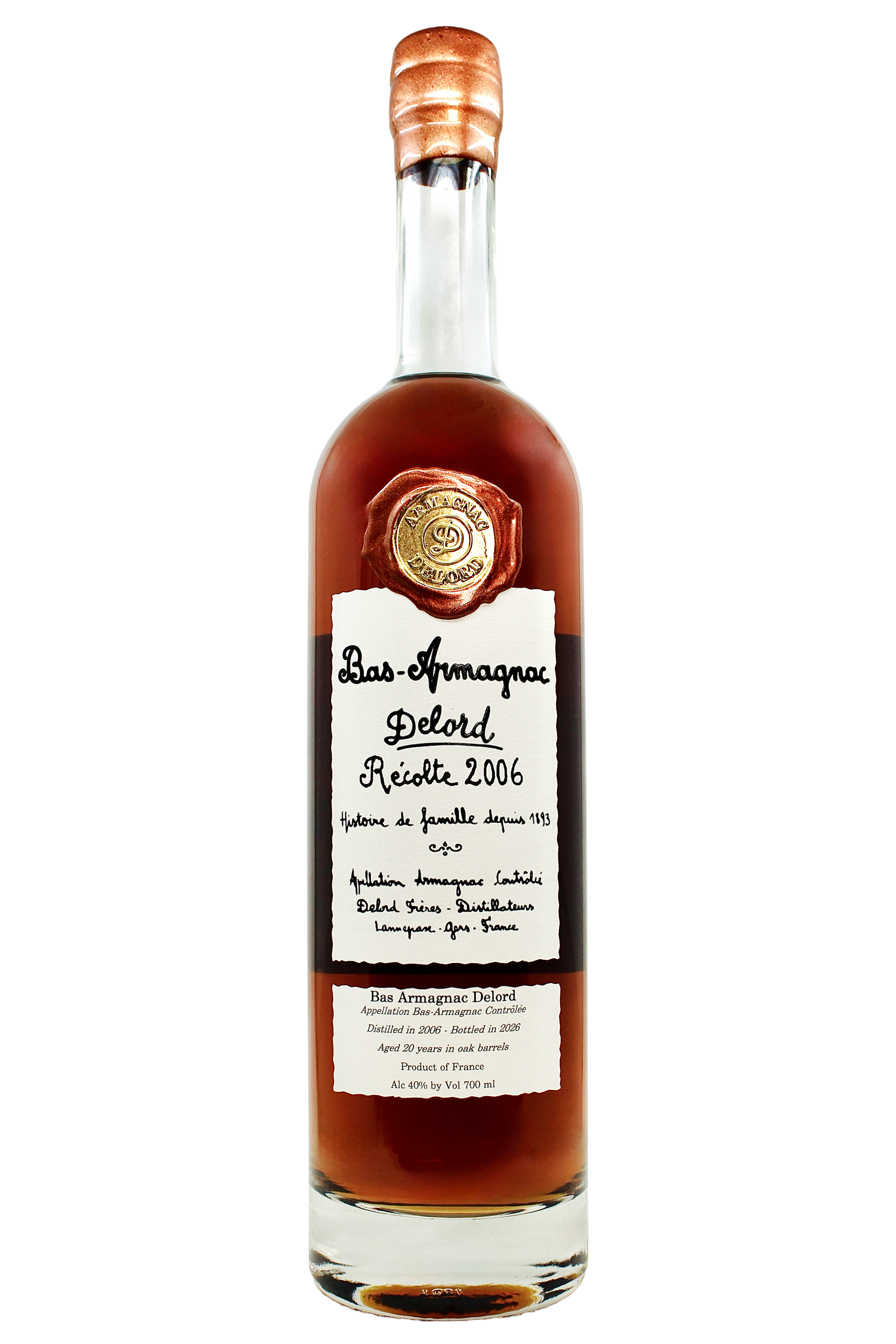 Close up on Delord Bas Armagnac 2006 vintage with an antique hand-written style label and copper wax seal.