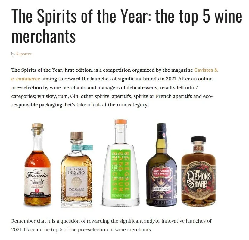 Image of an article titled 'The Spirits of the Year: the top 5 wine merchants,' showing five bottles of alcohol, including rum, arranged in a row.