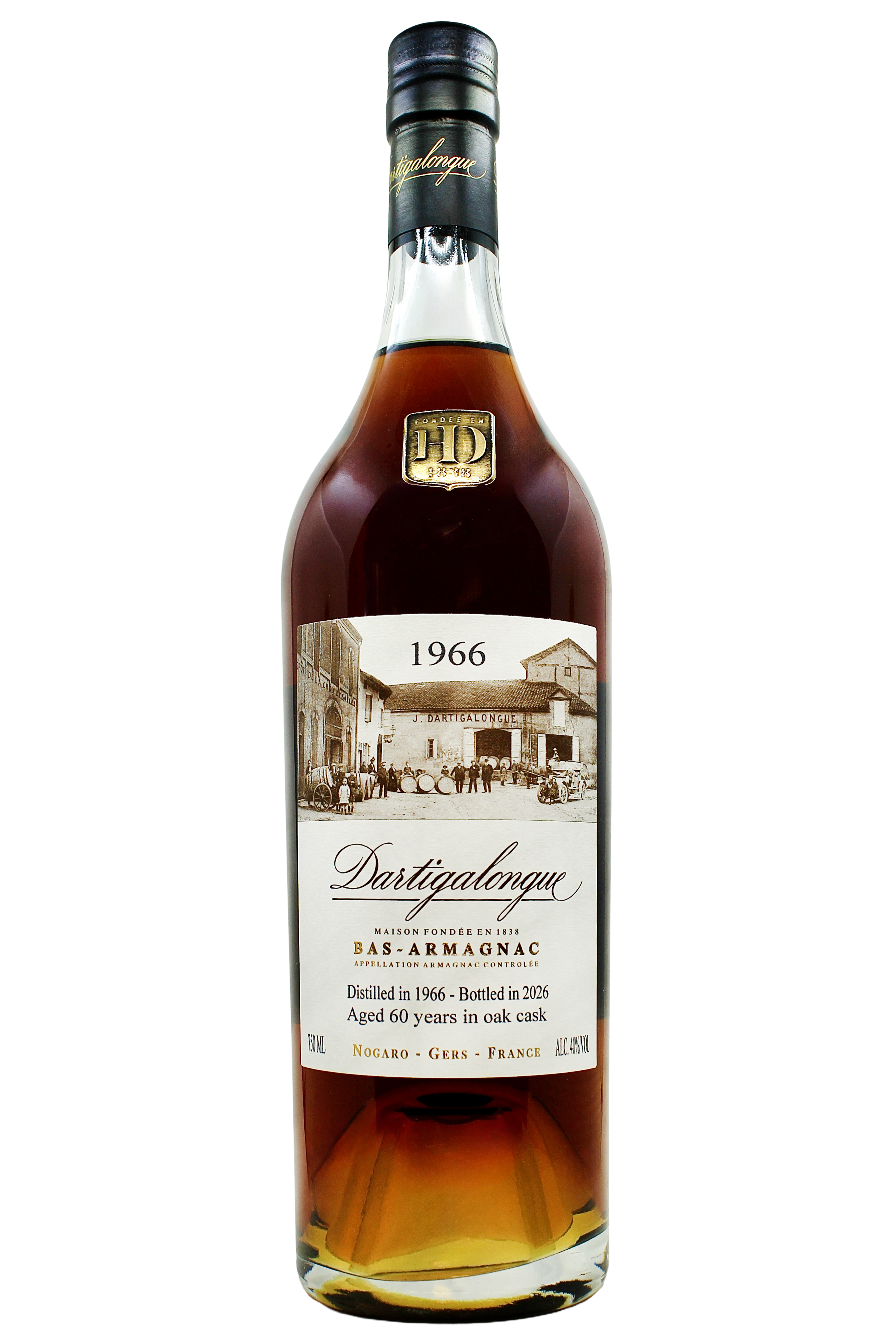 Close up on Dartigalongue Bas Armagnac 1966 vintage with an antique photo of the distillery's forecourt and gold seal on the neck. 