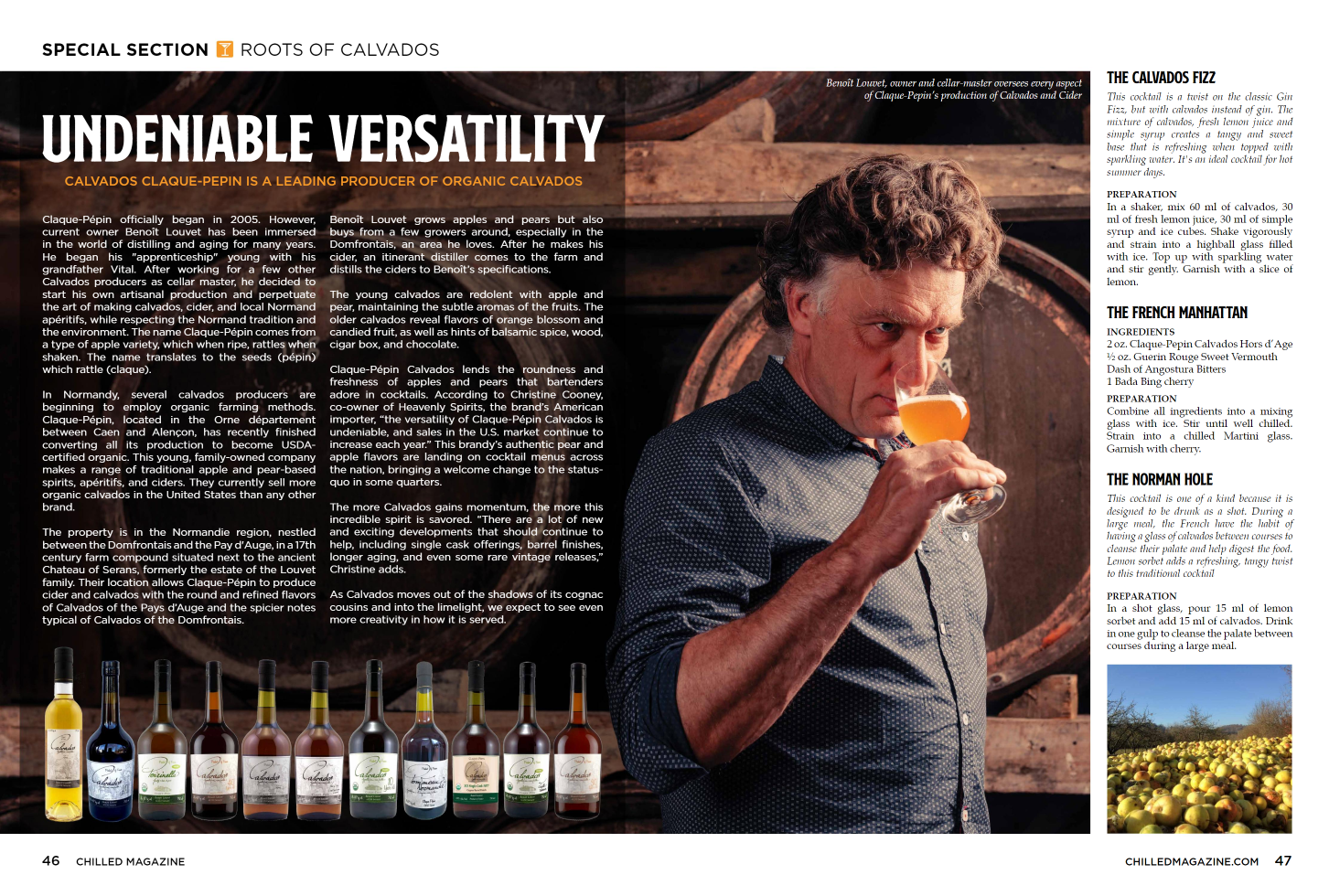 Man in front of wooden barrels sniffing a glass of cider