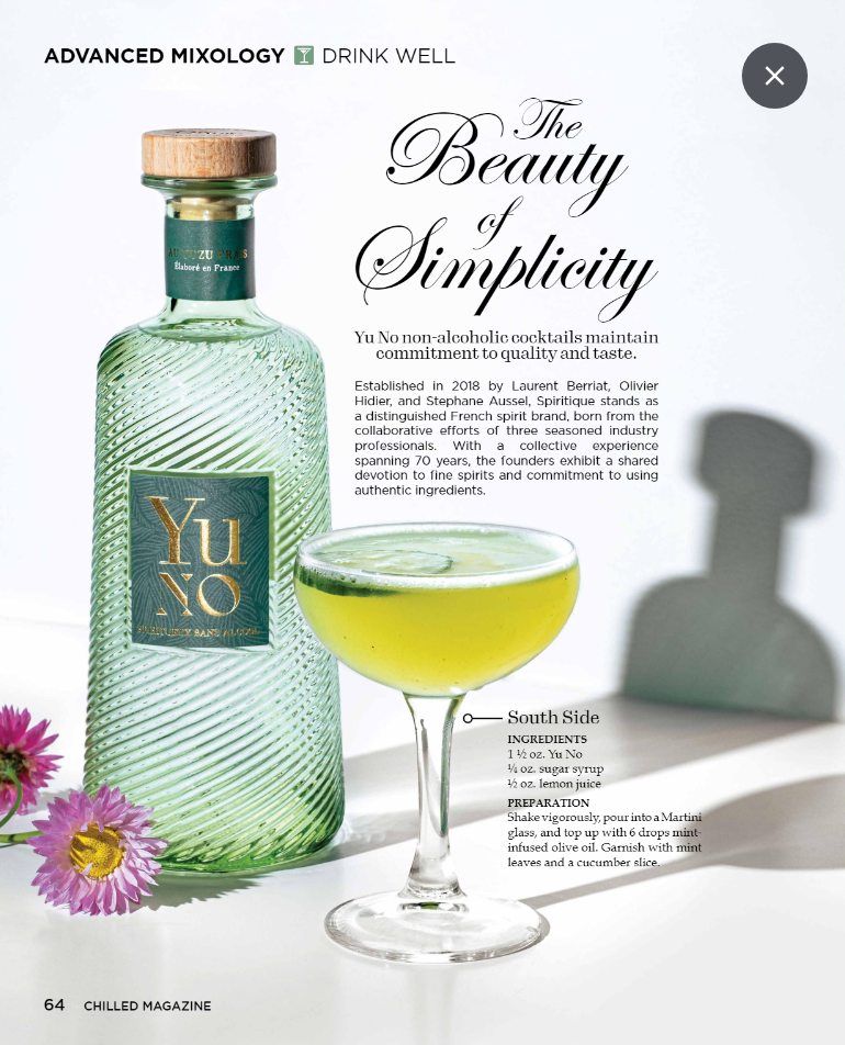 Yu No bottle with lime cocktail in a coupe glass