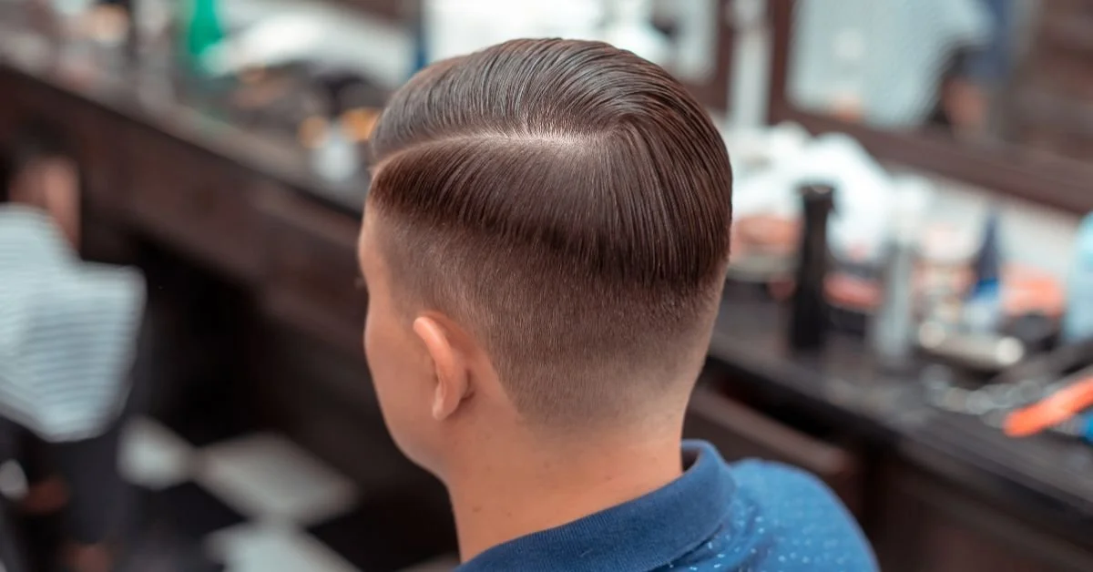 Men's taper haircut example at The Roost babershop.