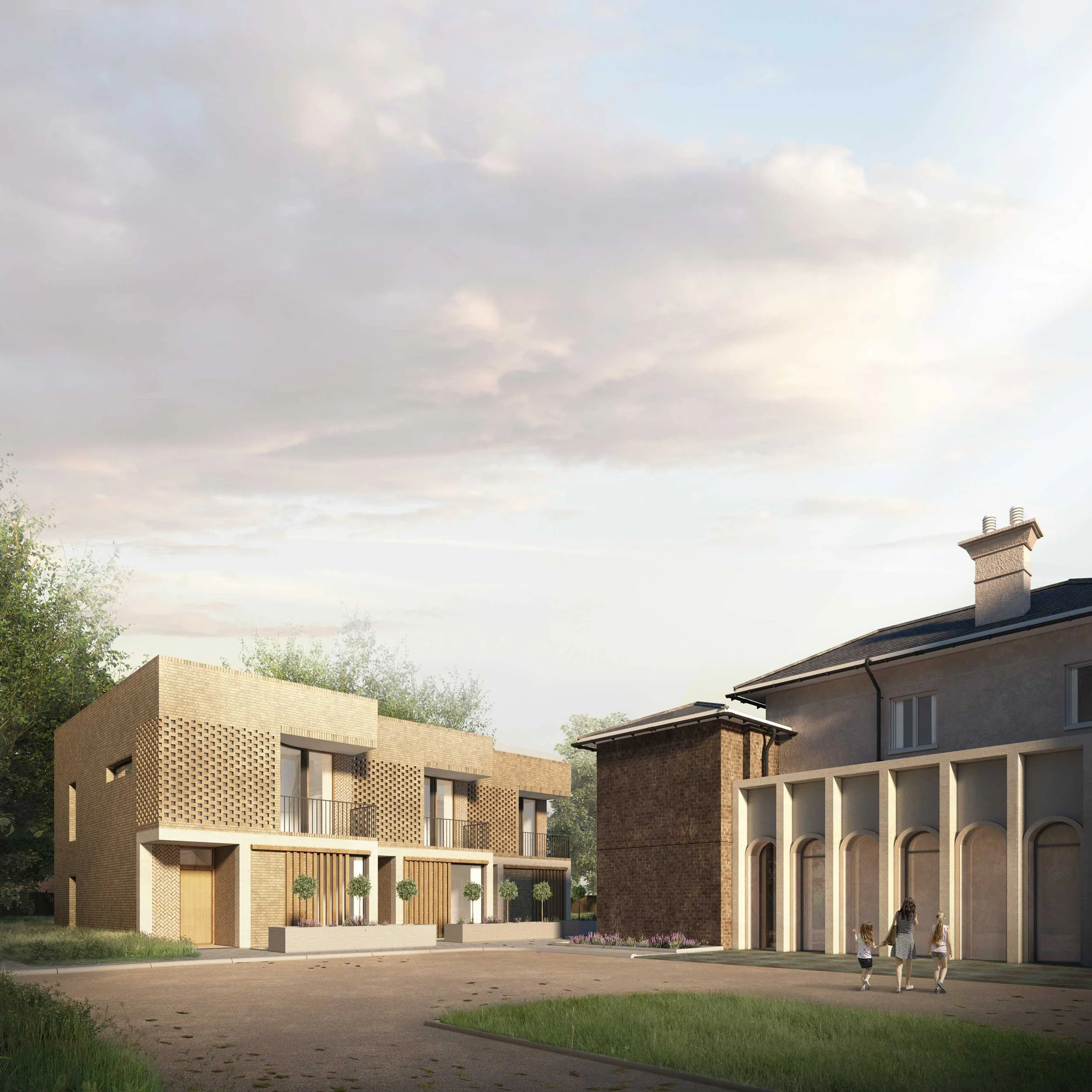 Modern new homes with brick and concrete facades, a paved area.