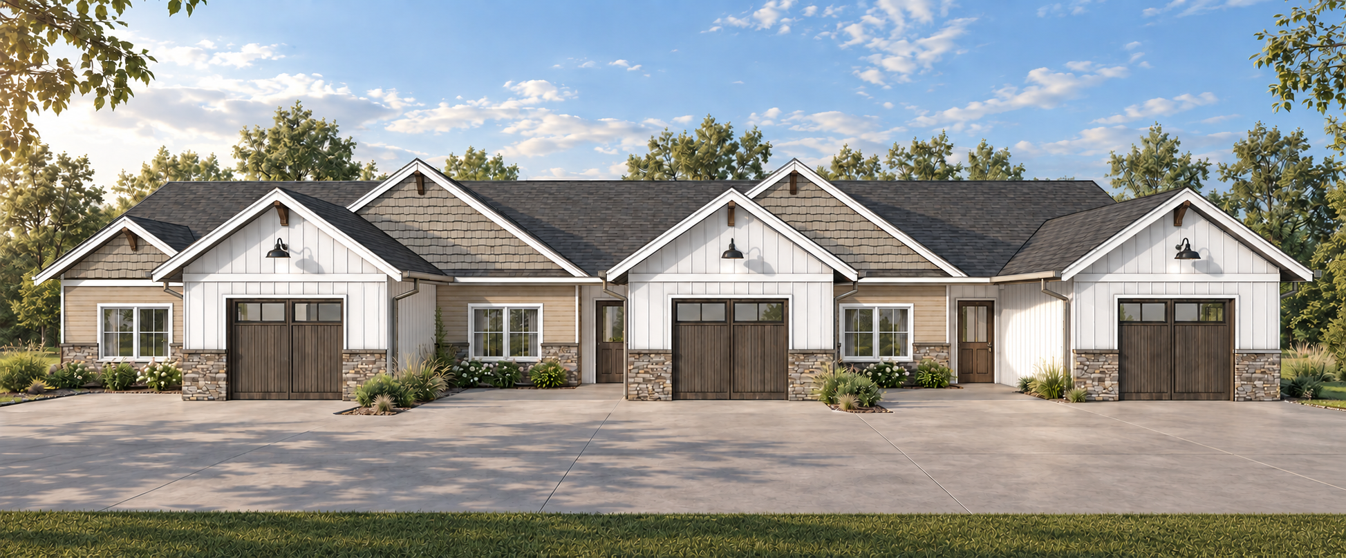 A row of three modern townhomes with white and beige siding, stone accents, and black garage doors, set against a blue sky with scattered clouds and green trees in the background.