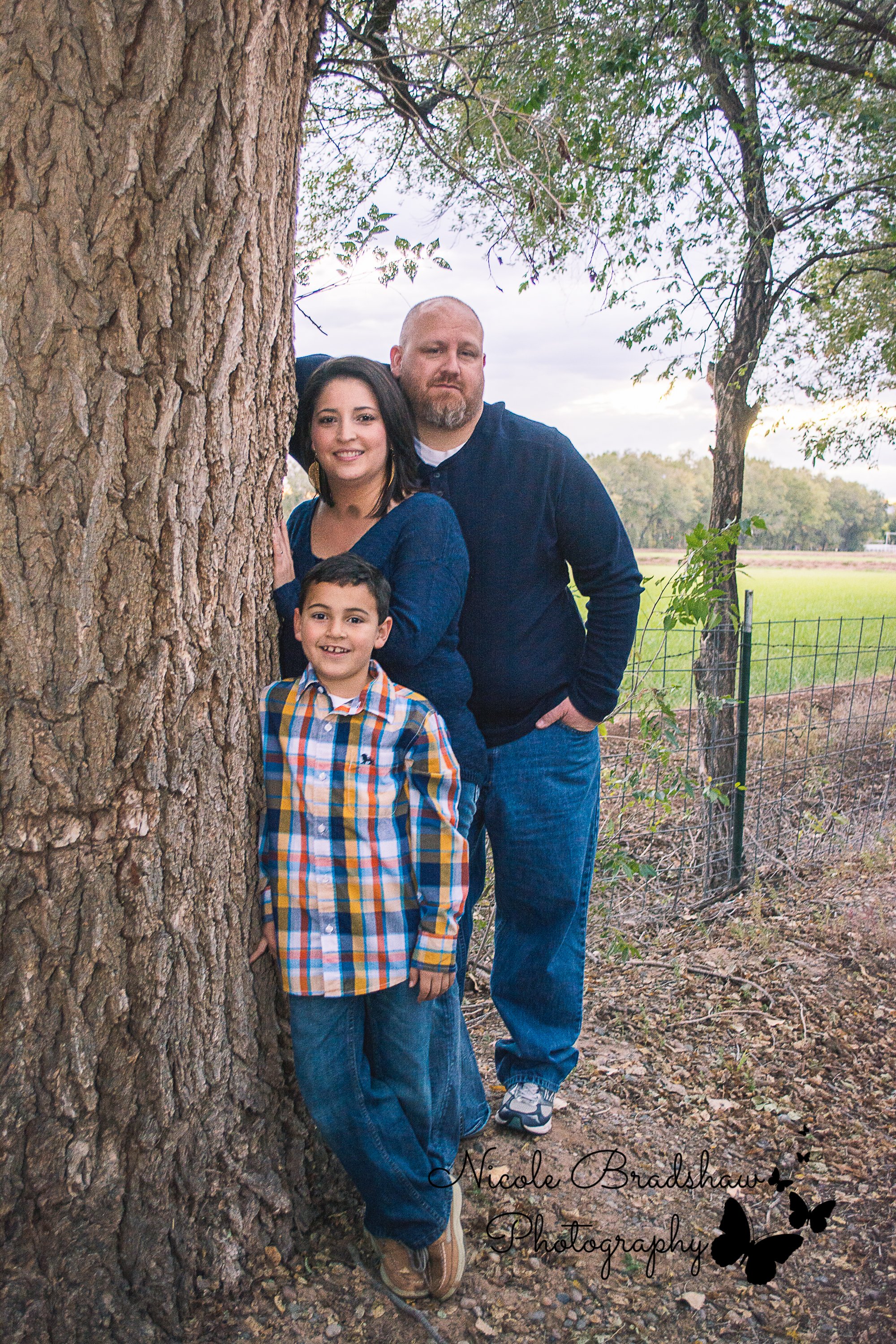 Family poses near a tree during Los Lunas Photo Session 