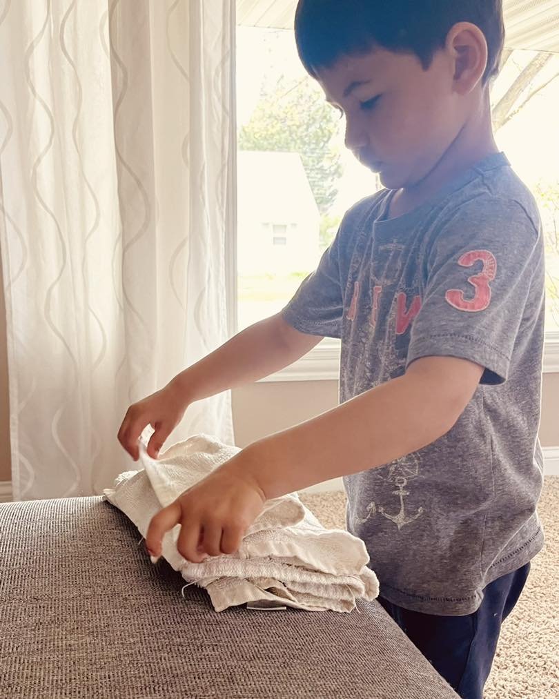 Such a good little helper. Folding the towels for Keyros Kitchen 😇