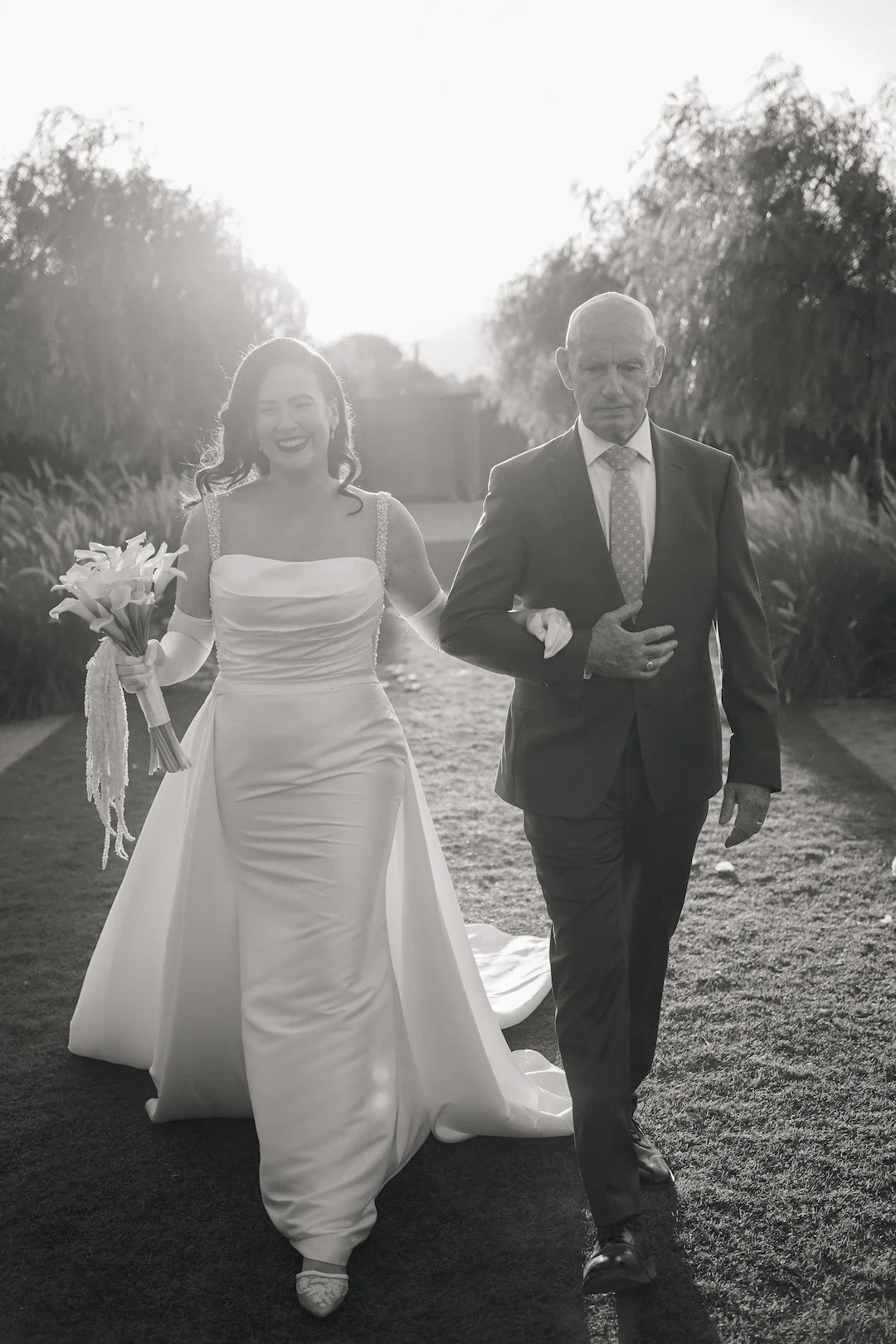 father walking his daughter down the aisle at orizontes estate