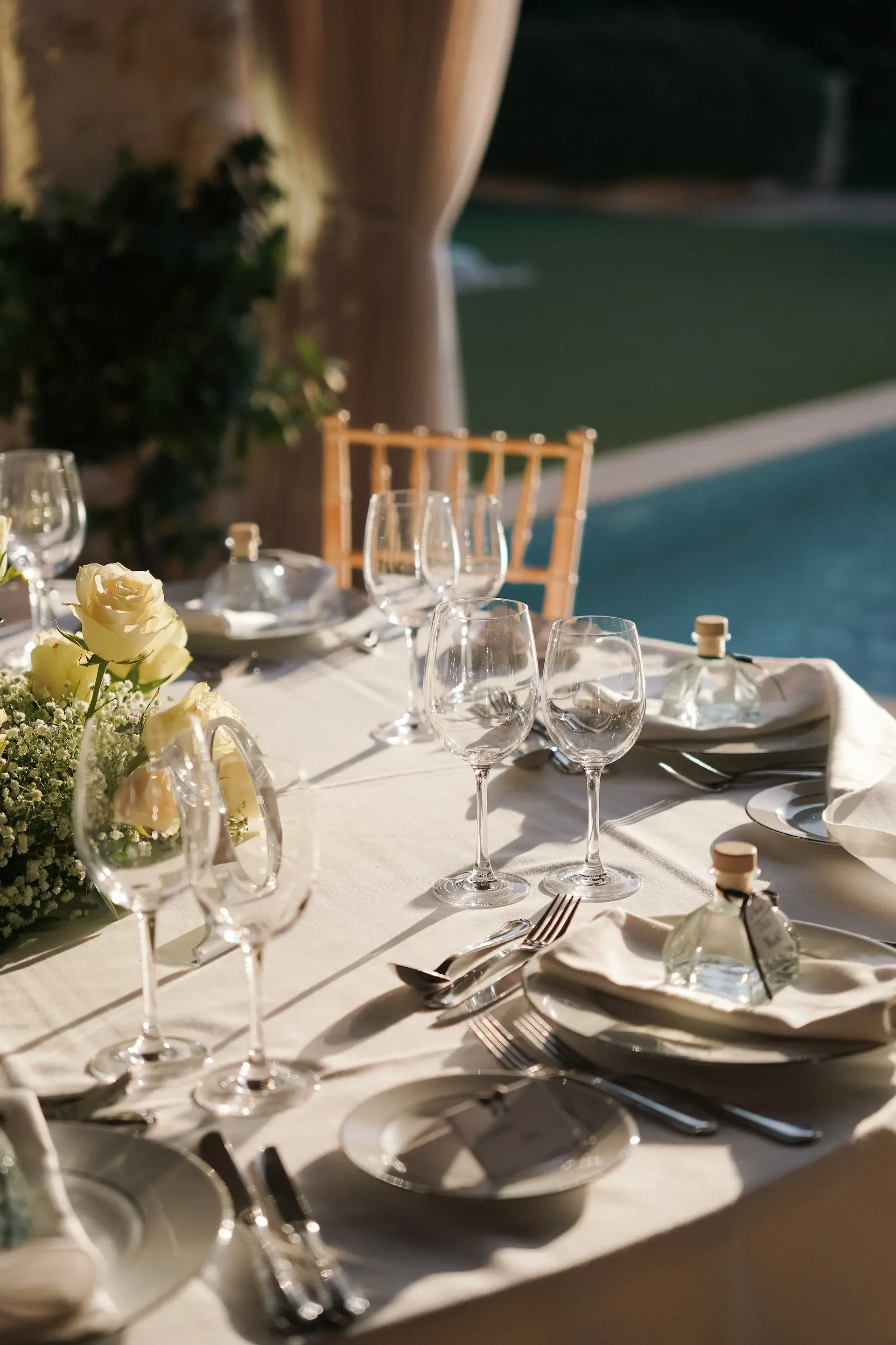 guests table decorated with flowers and facors