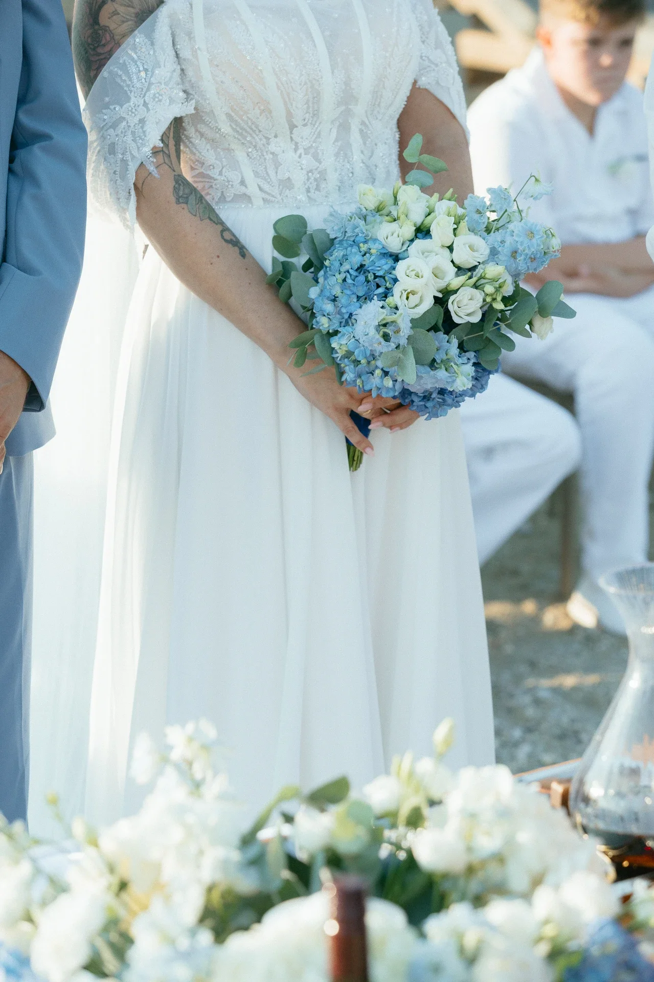 bridal-bouquet-with-white-and-blue-flowers.webp