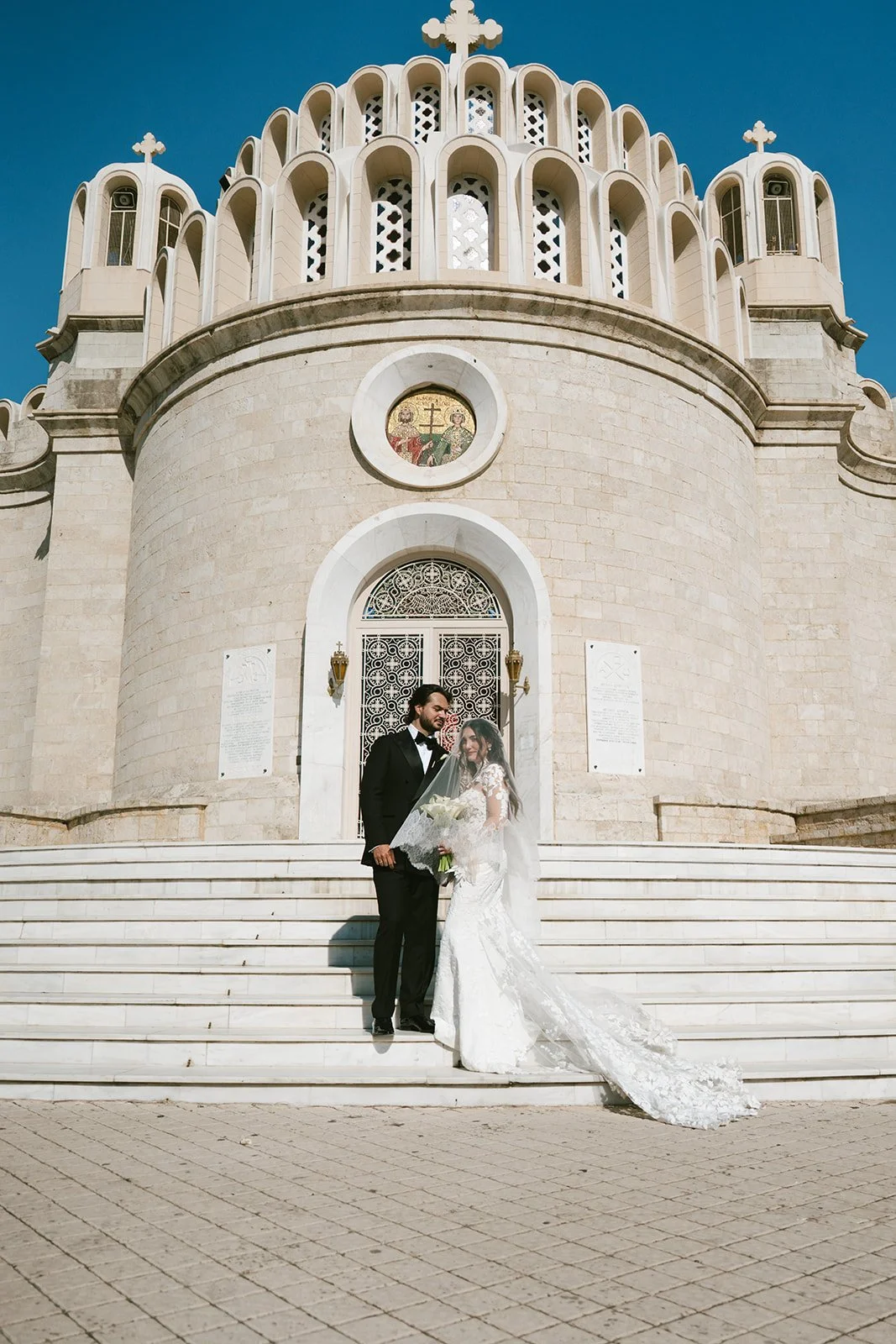 bride and groom photoshoot in front of the church