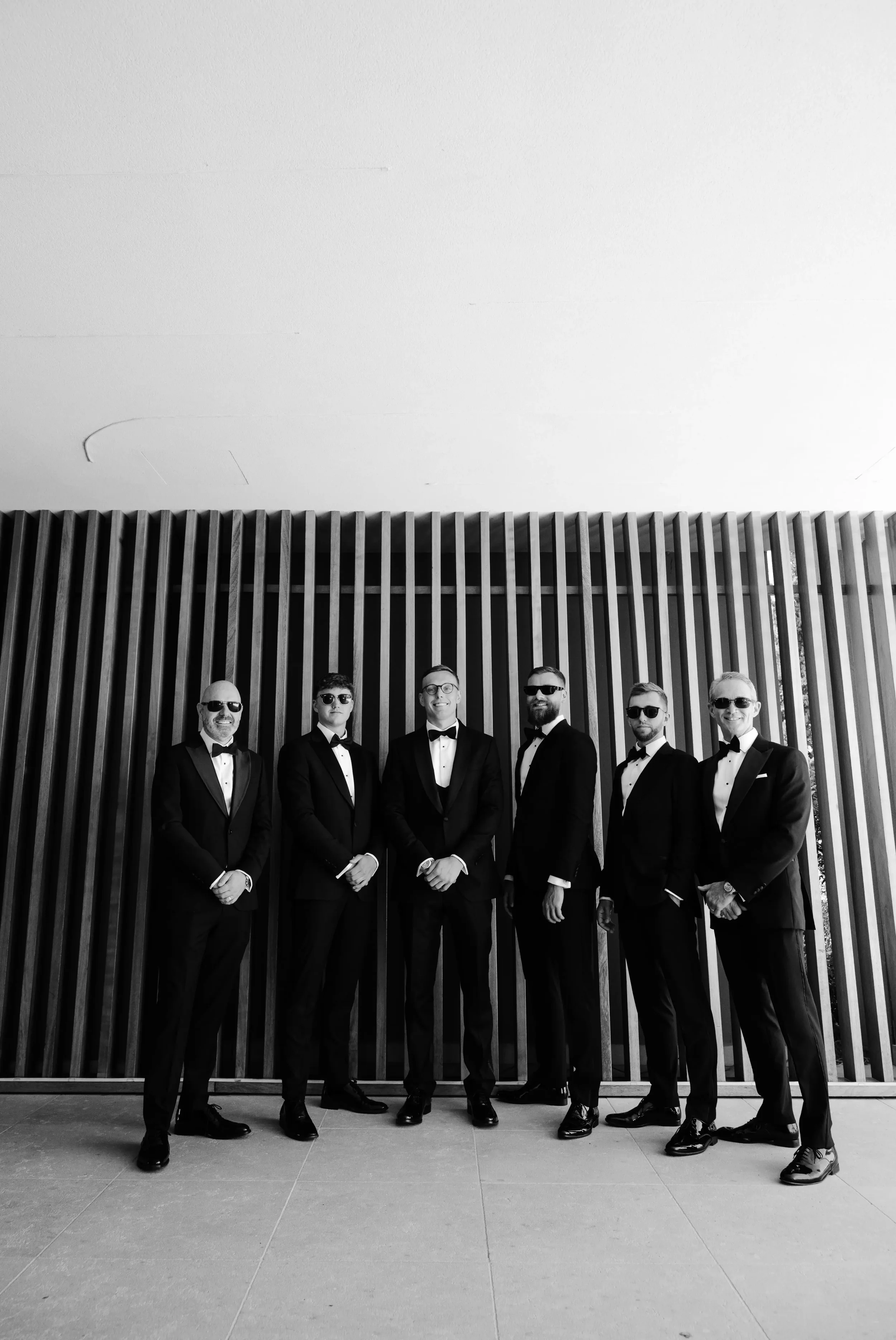 groom-and-groomsmen-posing.webp