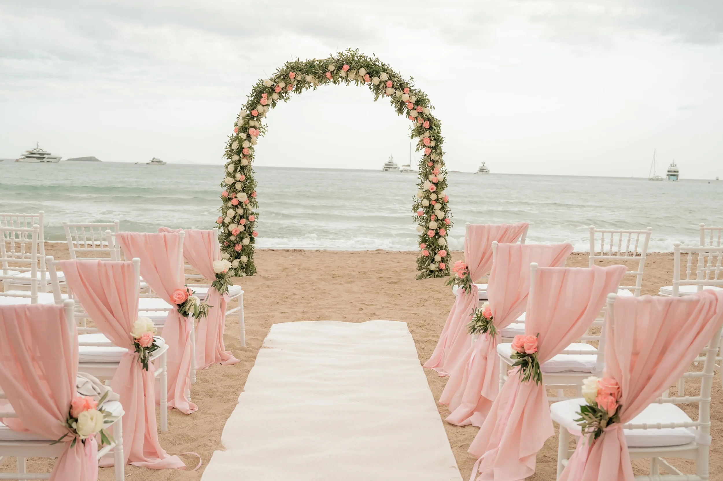 floral-arch-with-olive-branches-and-peonies.webp