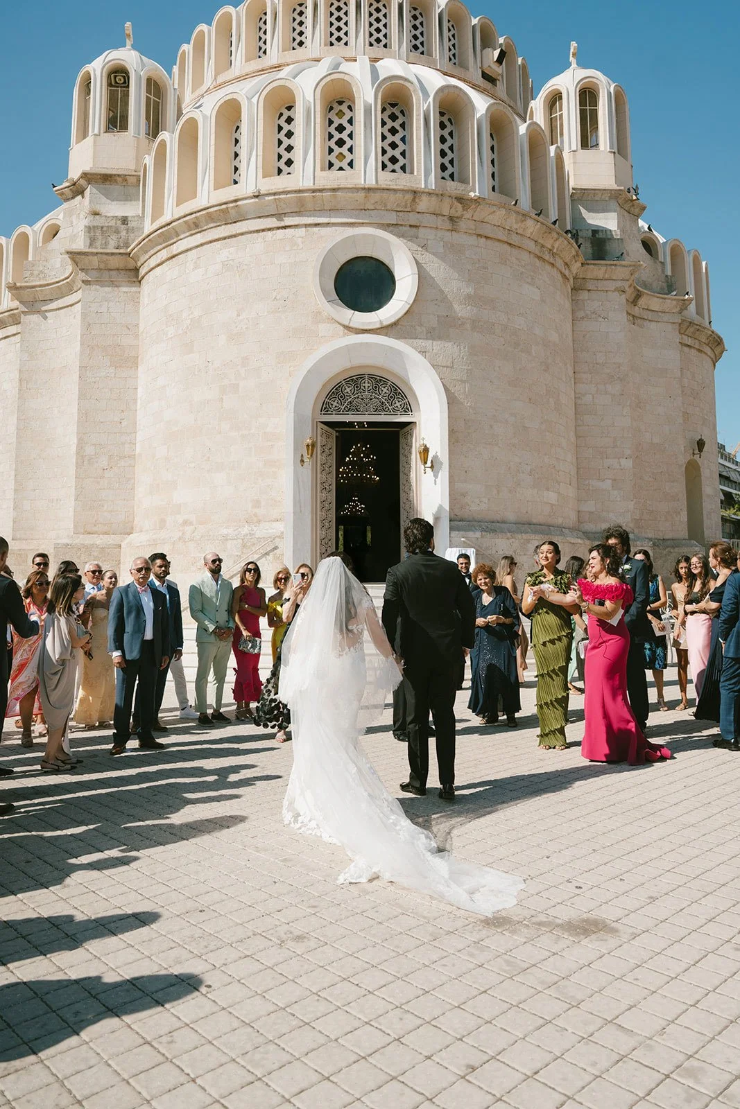 guests cheering the married couple