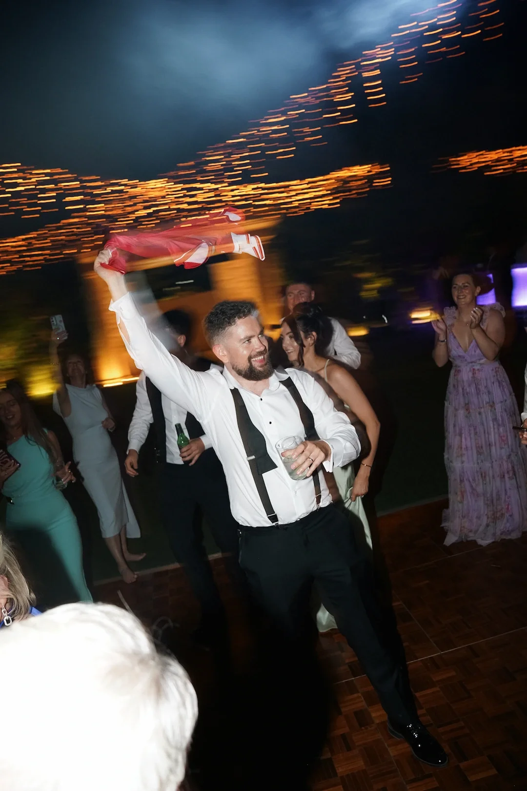 groom dancing with the guests