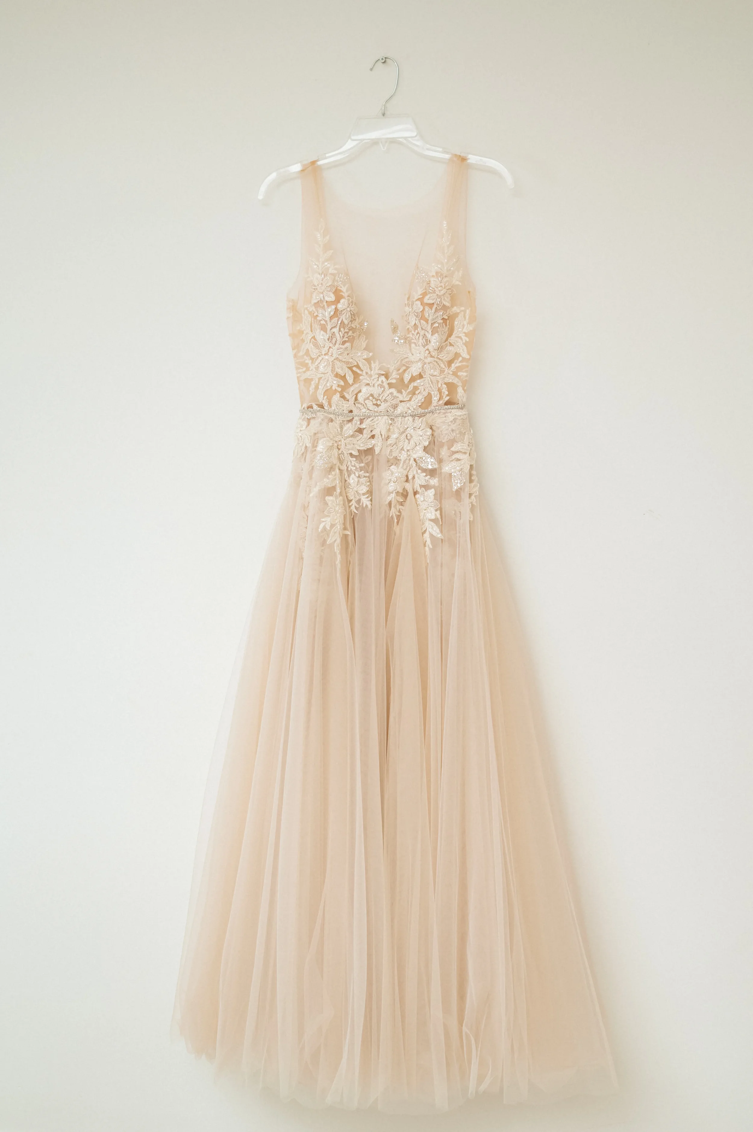 wedding-dress-hanging.webp