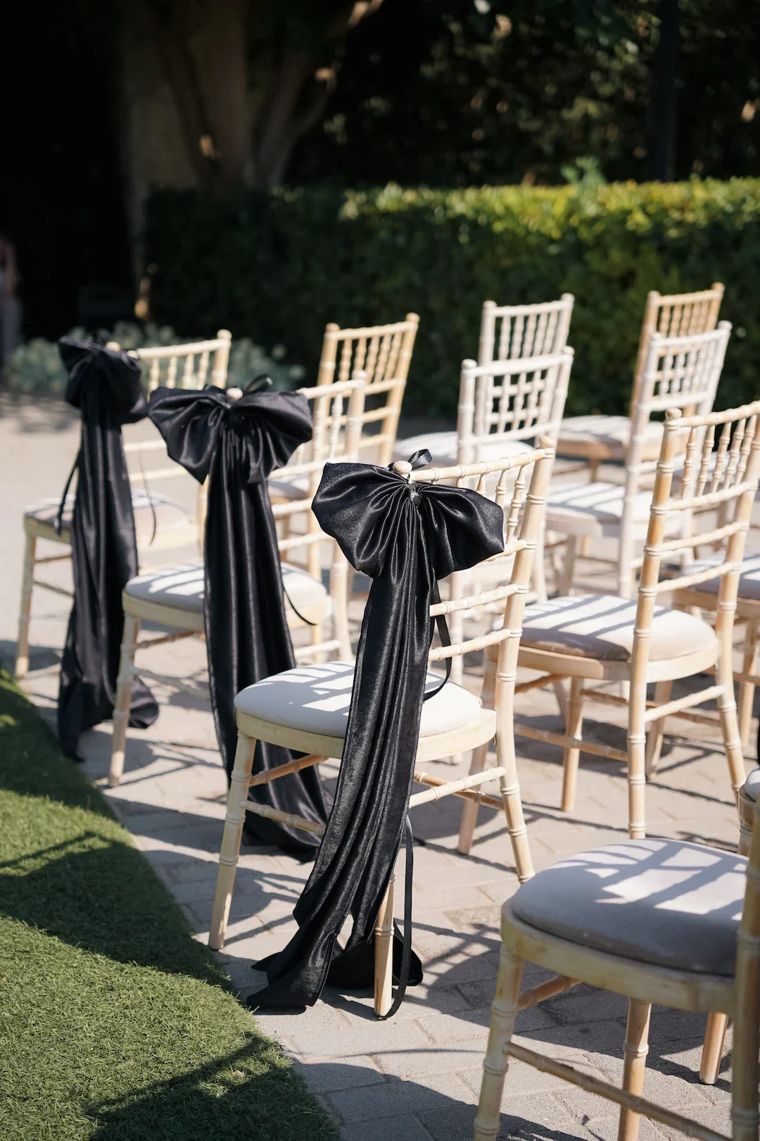 decorative bows dressing up the wedding chairs