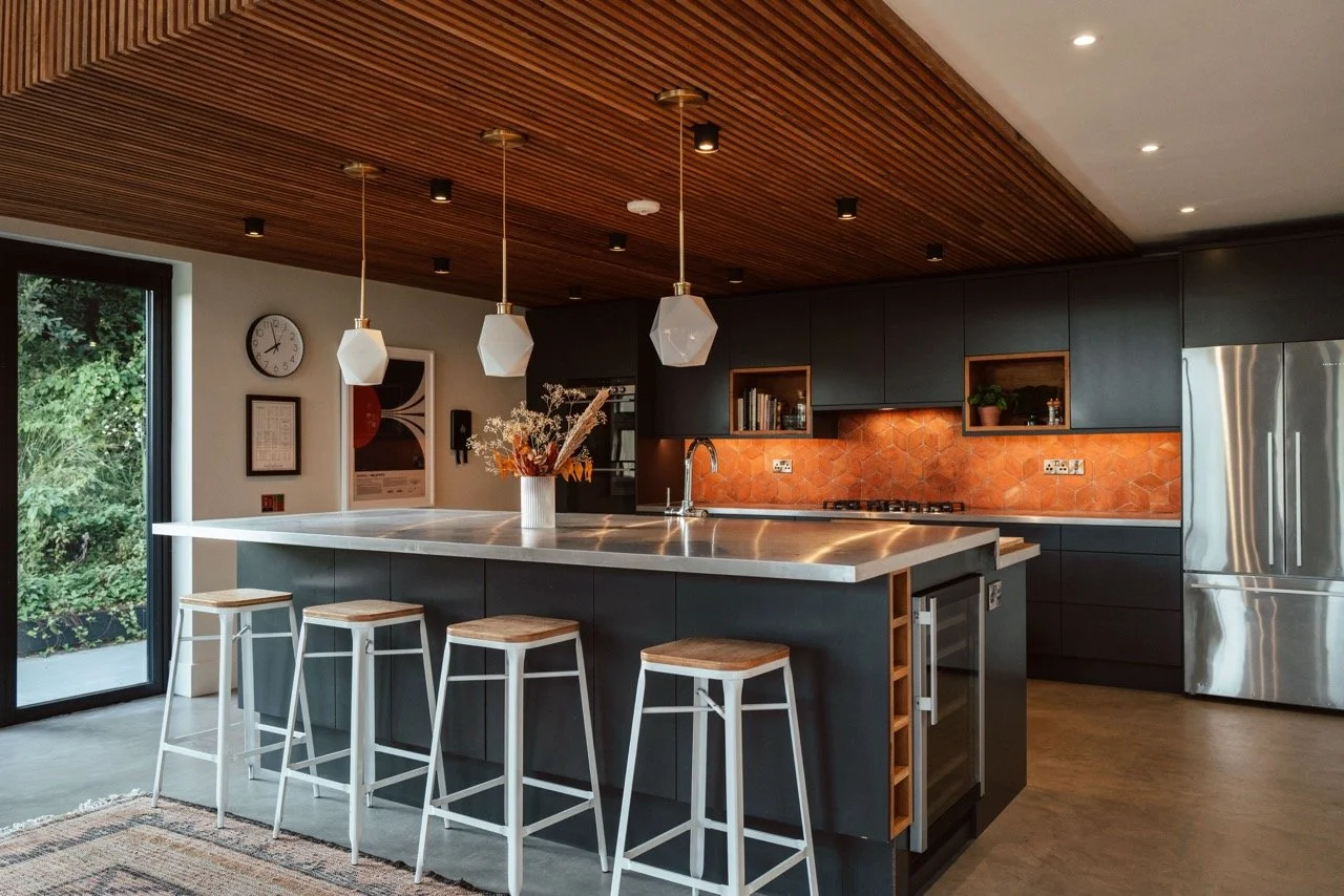 Modern open-plan kitchen with warm natural textures