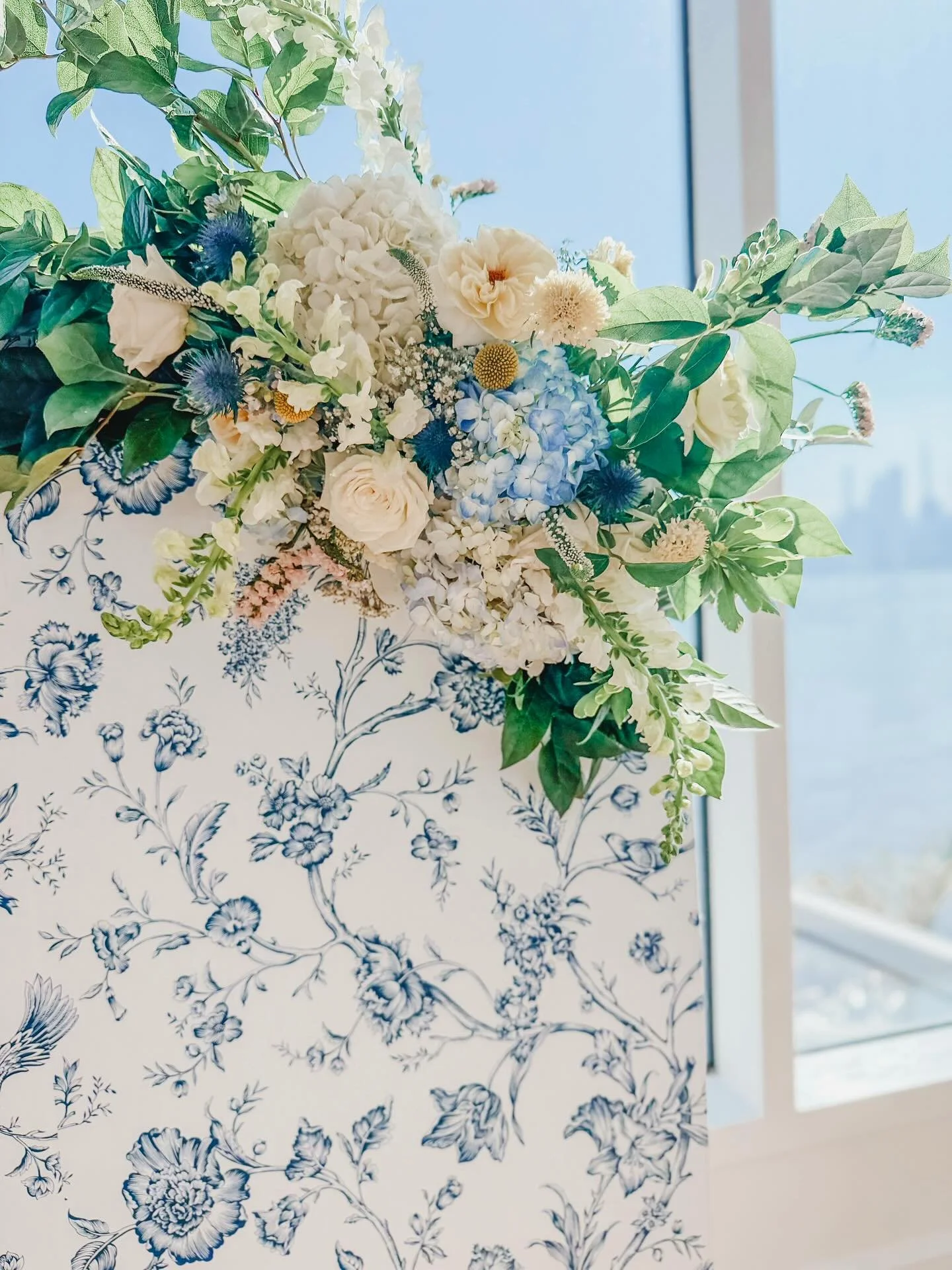 A sneak peek at this timeless setup overlooking the Hudson River and NYC skyline 💙🌿

A dreamy mix of fresh hydrangeas, buttery yellow and ivory roses, and lush greenery. Perfectly paired with our blue floral toile backdrop for a classic, romantic t