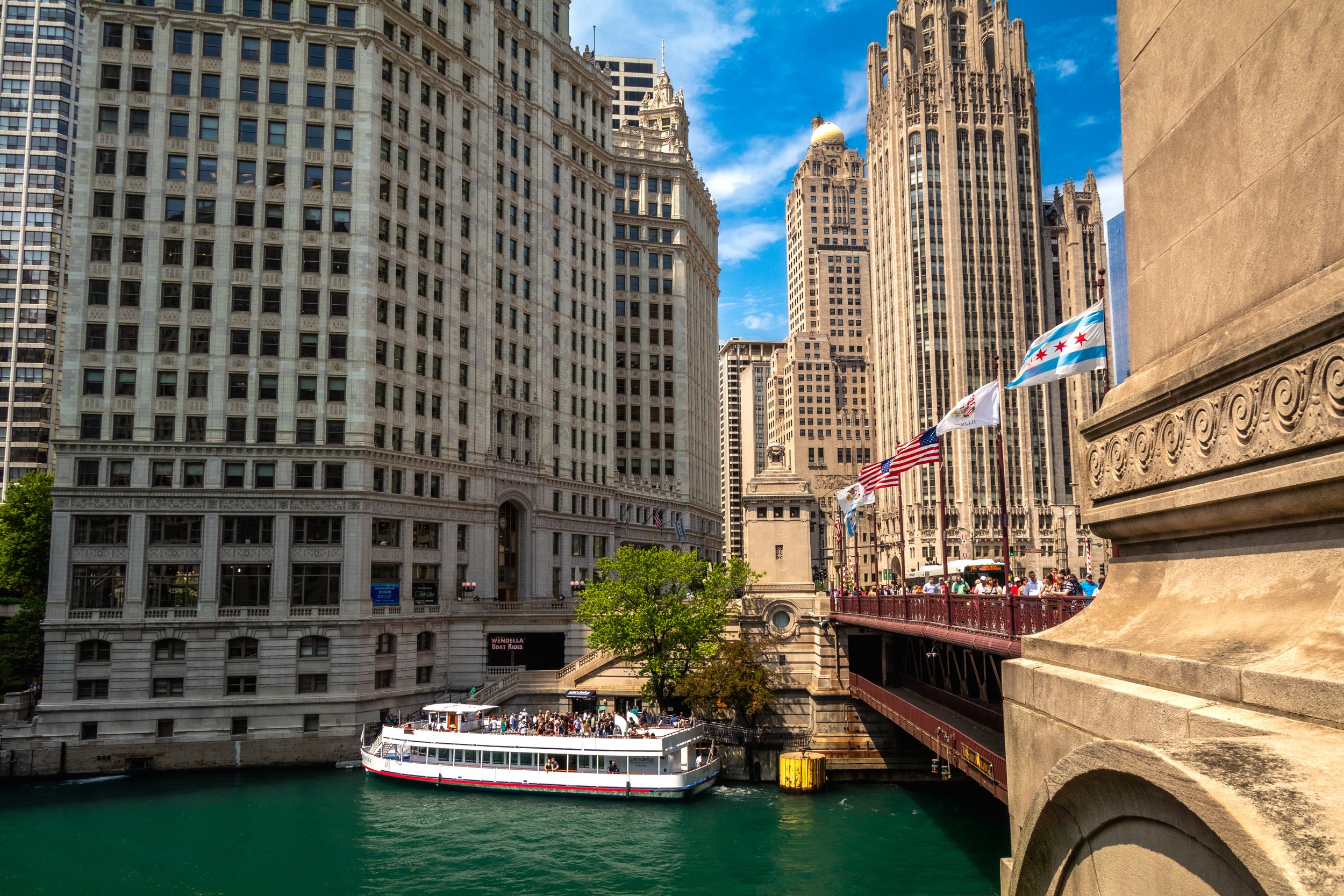 Chicago River with boat and skyscrapers
