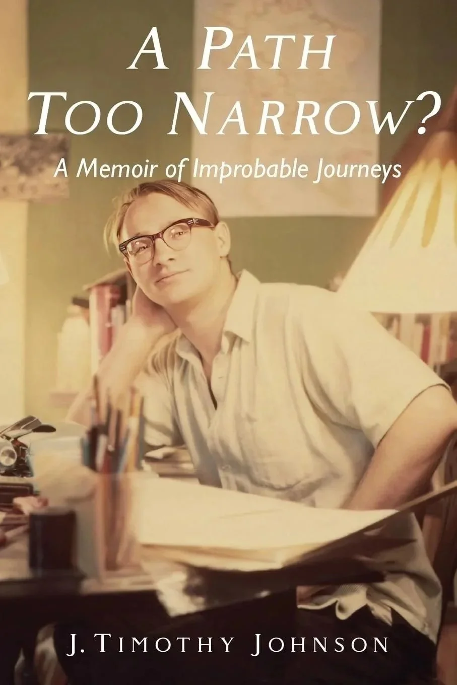 Front cover of the book young man with glasses at a desk looking directly at you