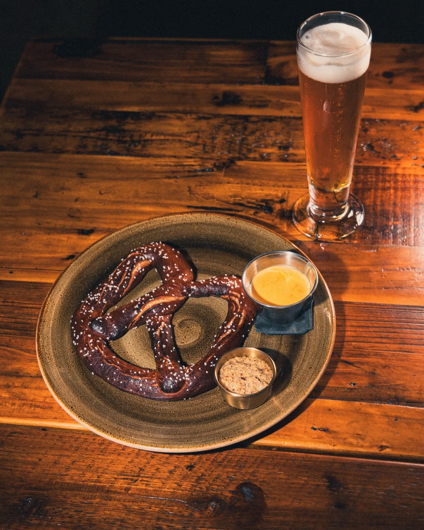 We heard our Oktoberfest was looking a little lonely, so Chef fixed that and gave the M&auml;rzen a friend: meet our pretzel. It&rsquo;s made with rye flour and served with a side of beer cheese and spicy mustard. But if those aren&rsquo;t for you, g
