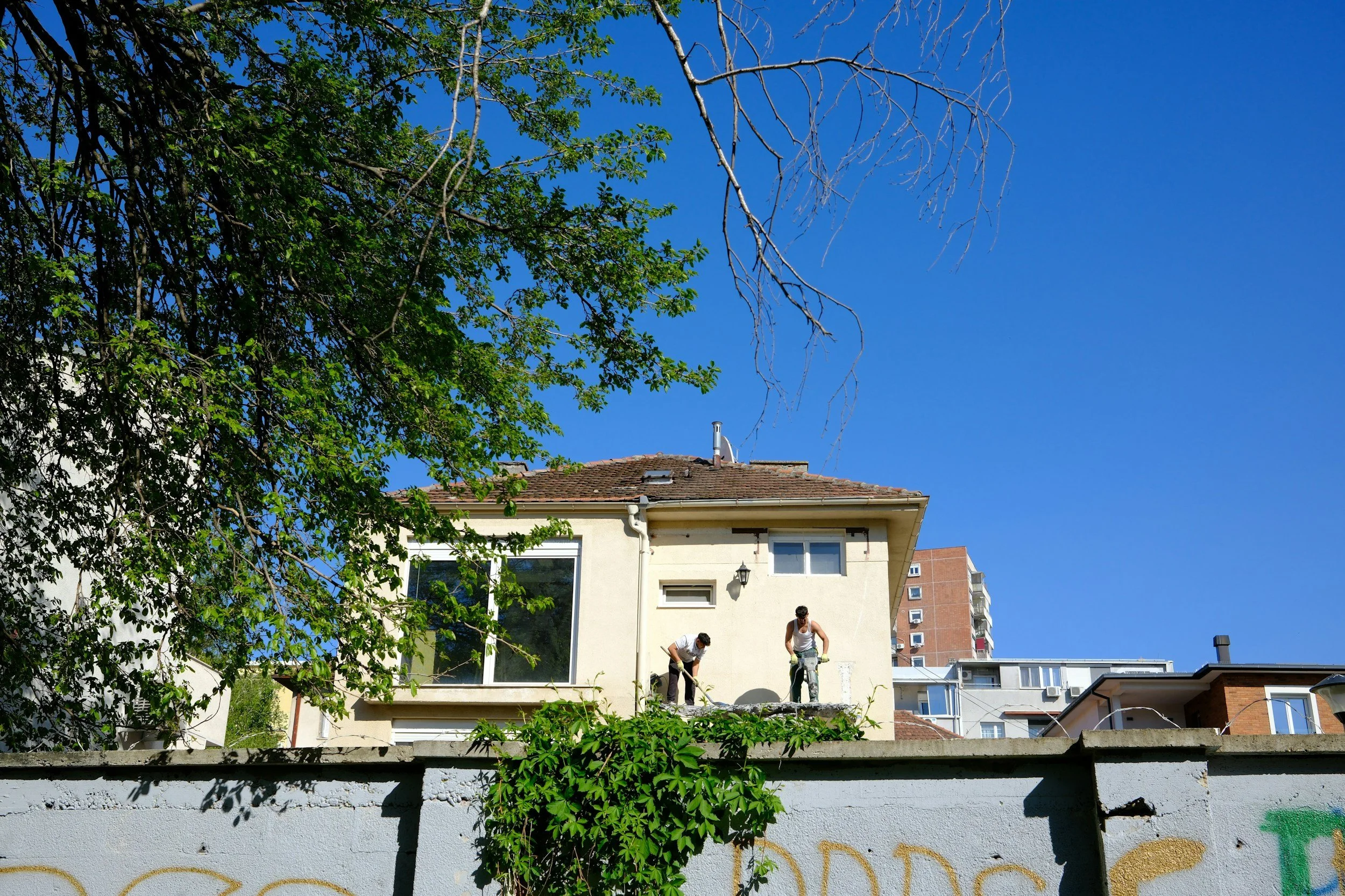 Mixed-use development with maintained common areas representing vendor coordination and property maintenance services.