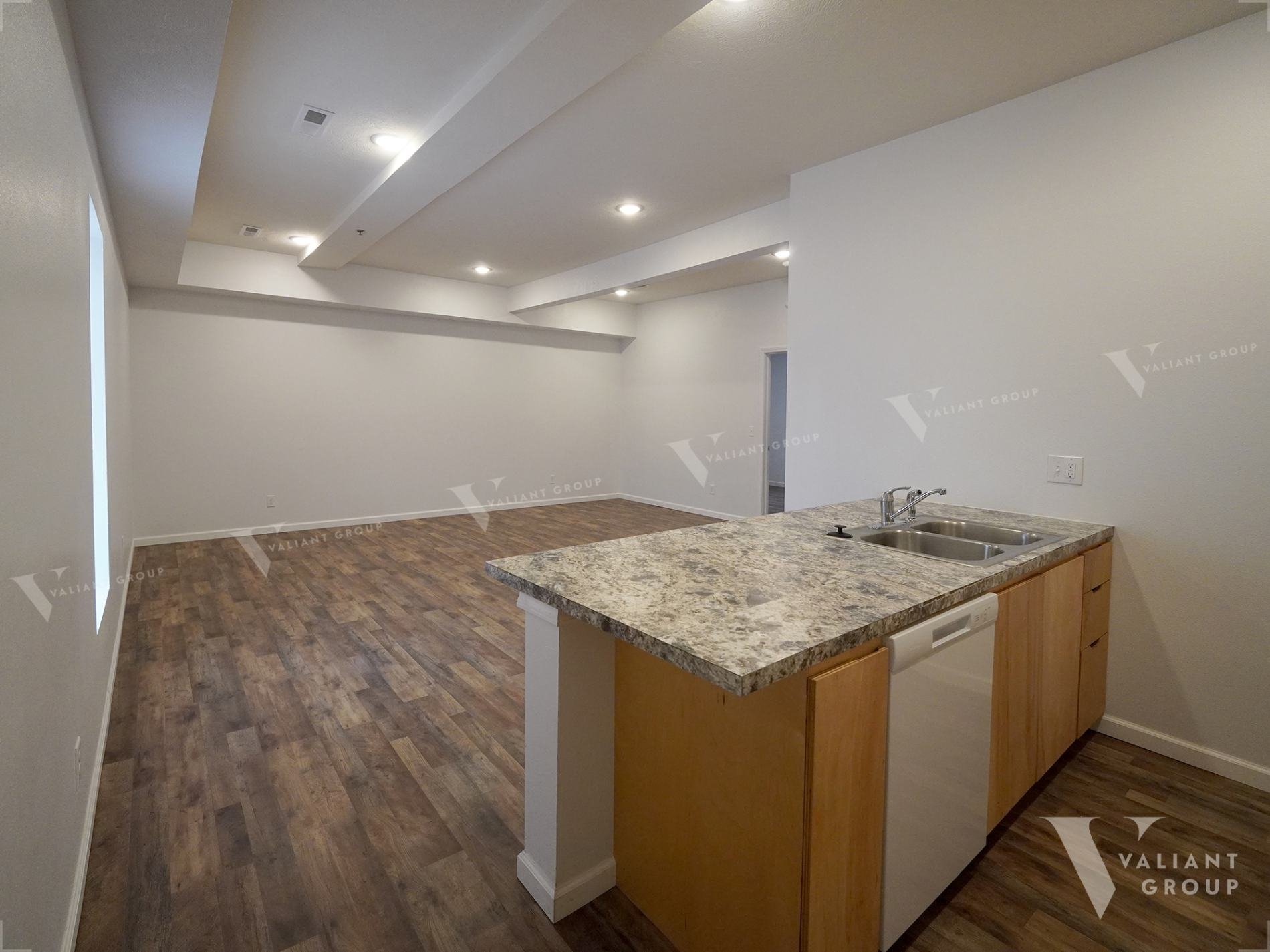 Loft-Apartments-2420-E-Blaine-St-Springfield-MO-01-Kitchen-Living-Room.jpg