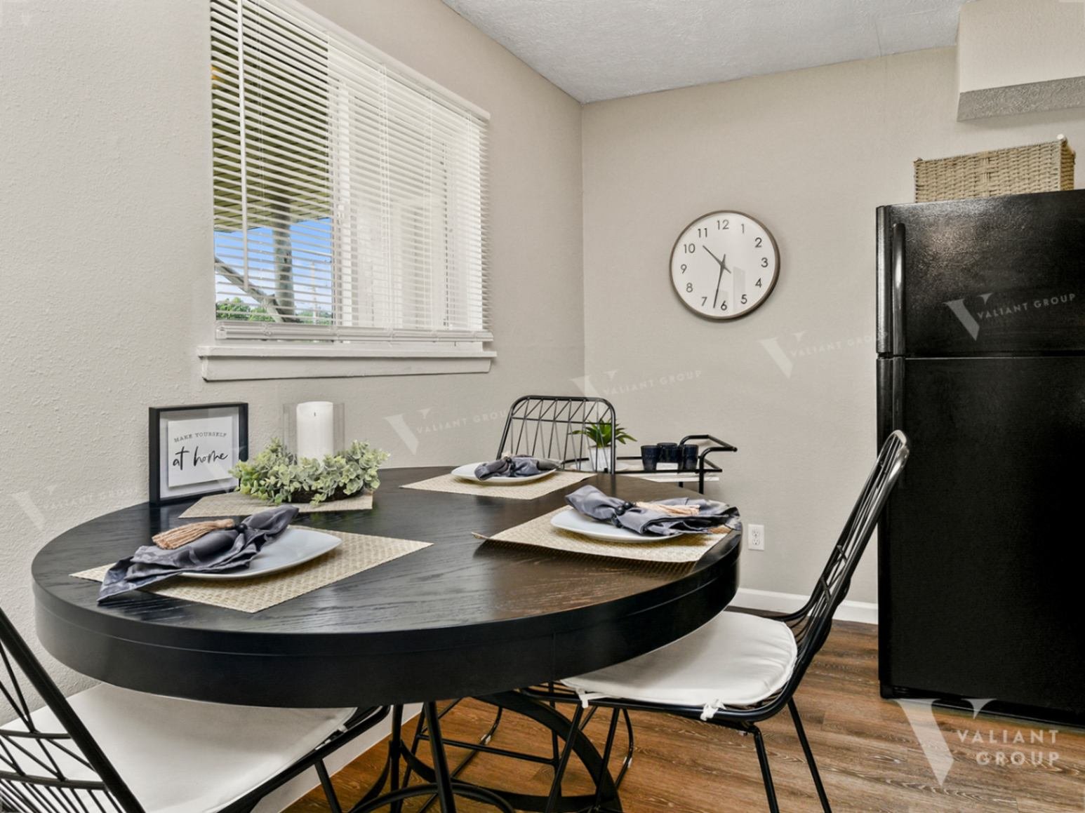 04-Cherry-Creek-Apartments-dining-room-table-place-settings-clock.jpg