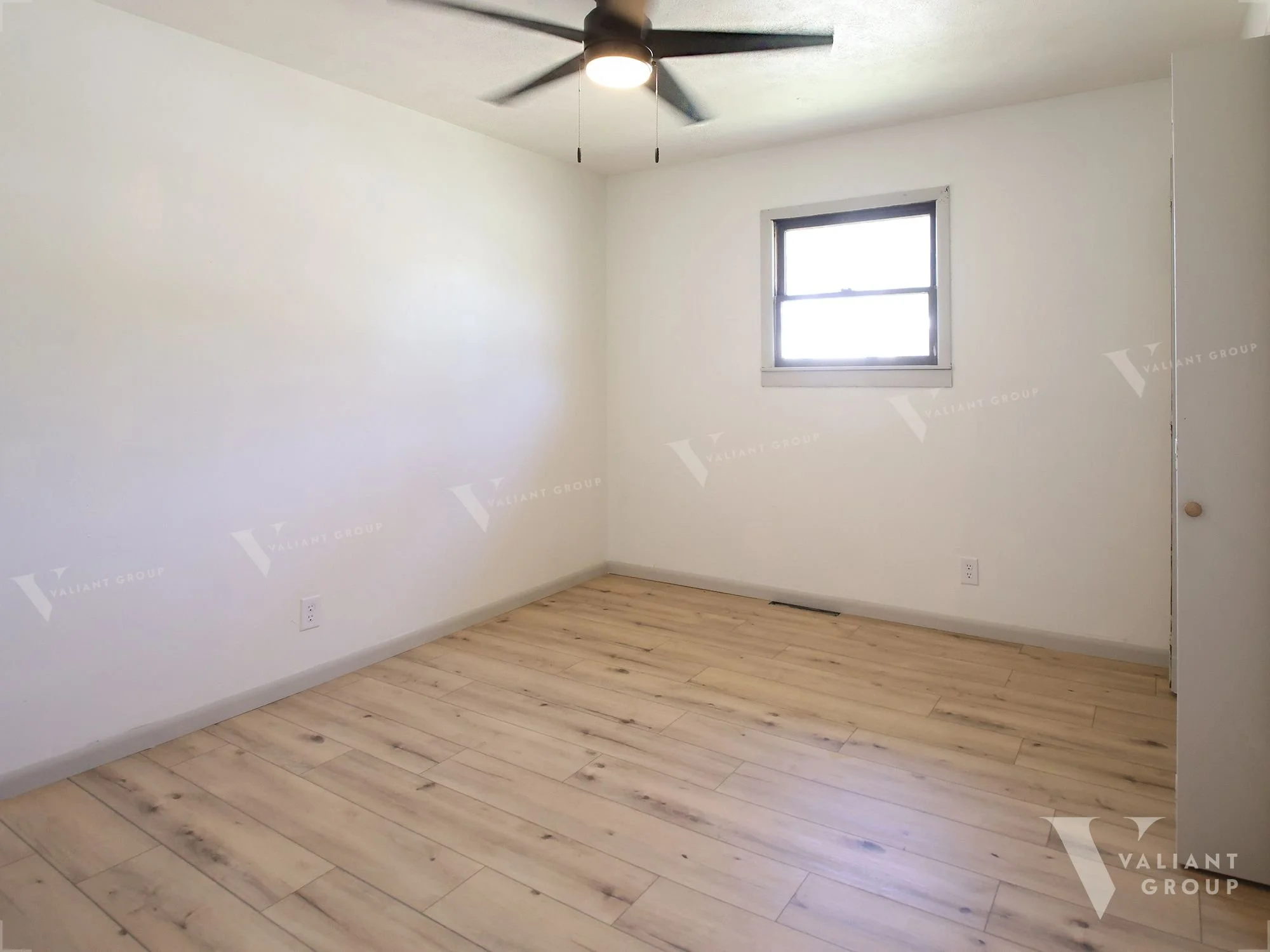 10-1438-W-State-St-main-bedroom-ceiling-fan-window.jpg