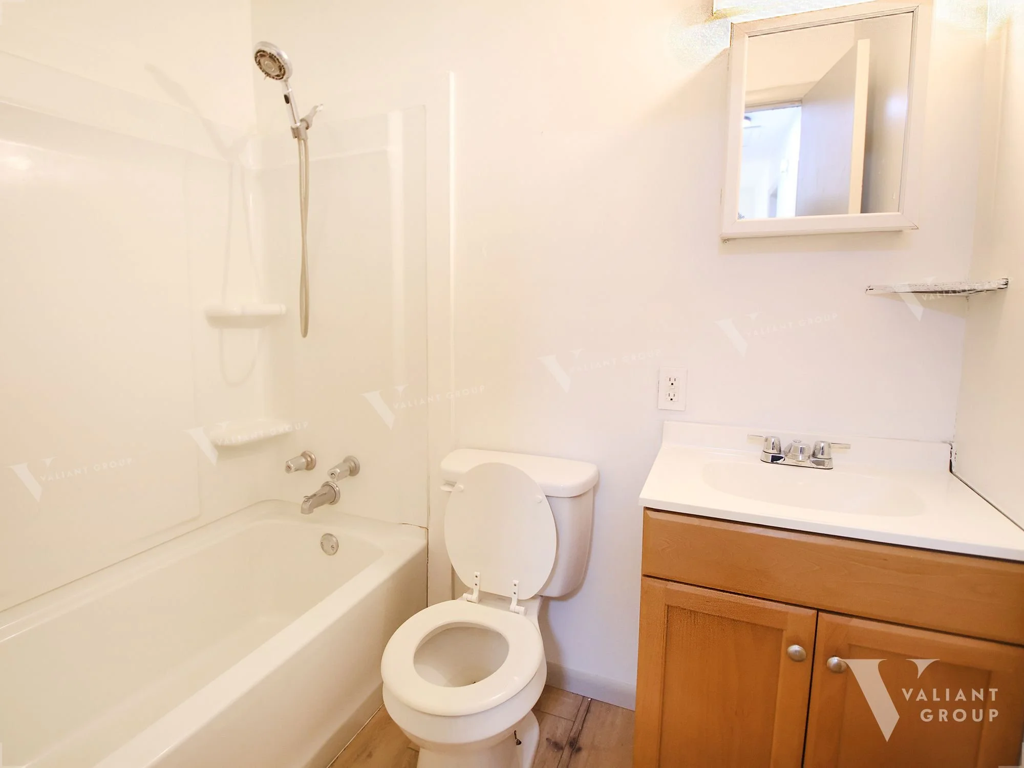 13-1438-W-State-St-bathroom-shower-toilet-sink.jpg