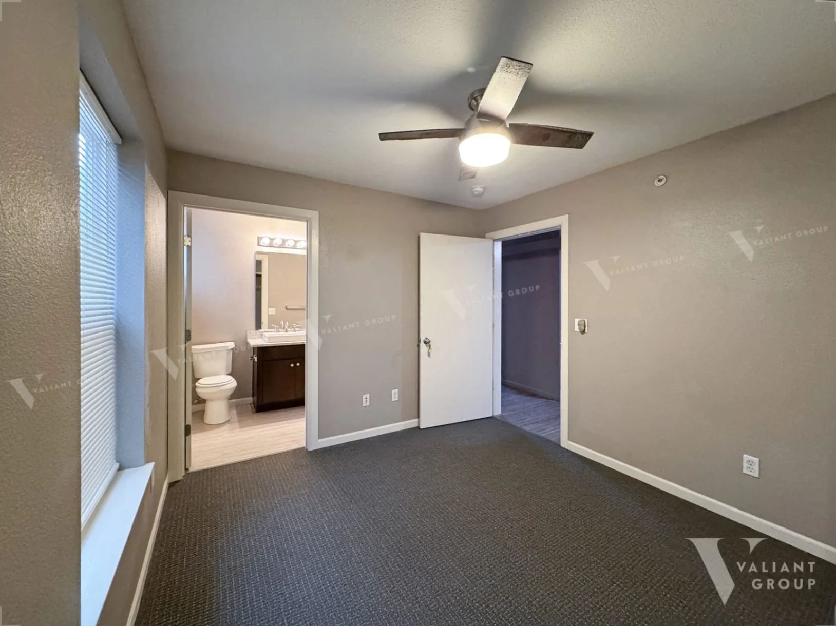 Walnut-Quads-Bedroom-A-door-window-fan.jpg