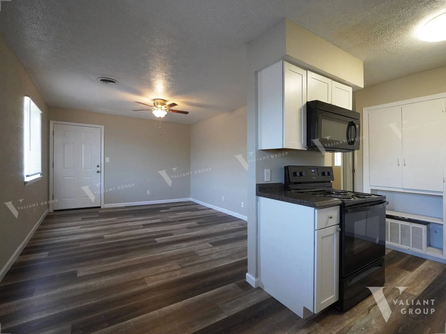 2107-E-Cherry-St-Apt-206--04-Living-Room-Kitchen-Stove.jpg