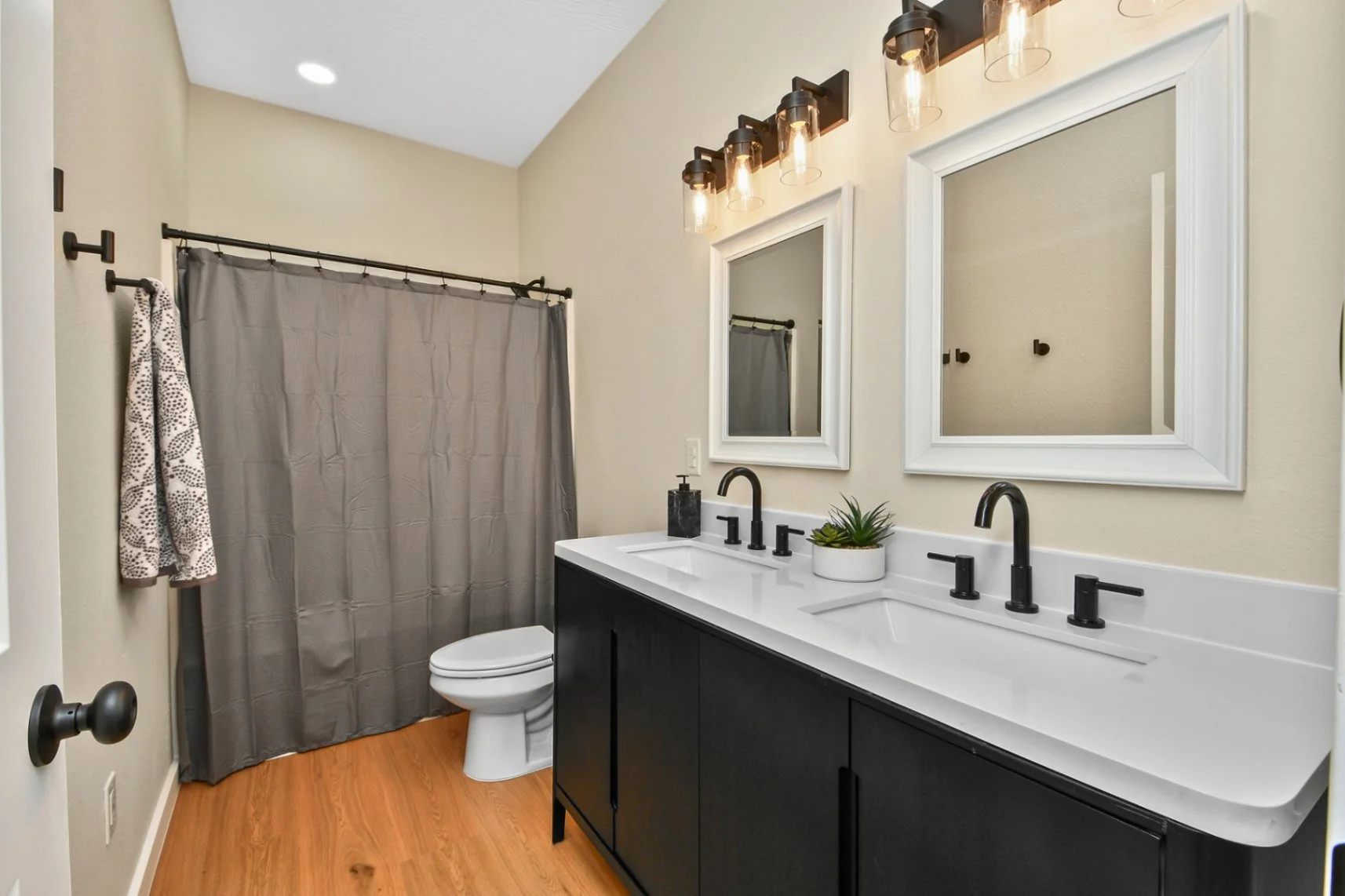 Downstairs Bathroom has Bathtub and Shower Dual Sinks