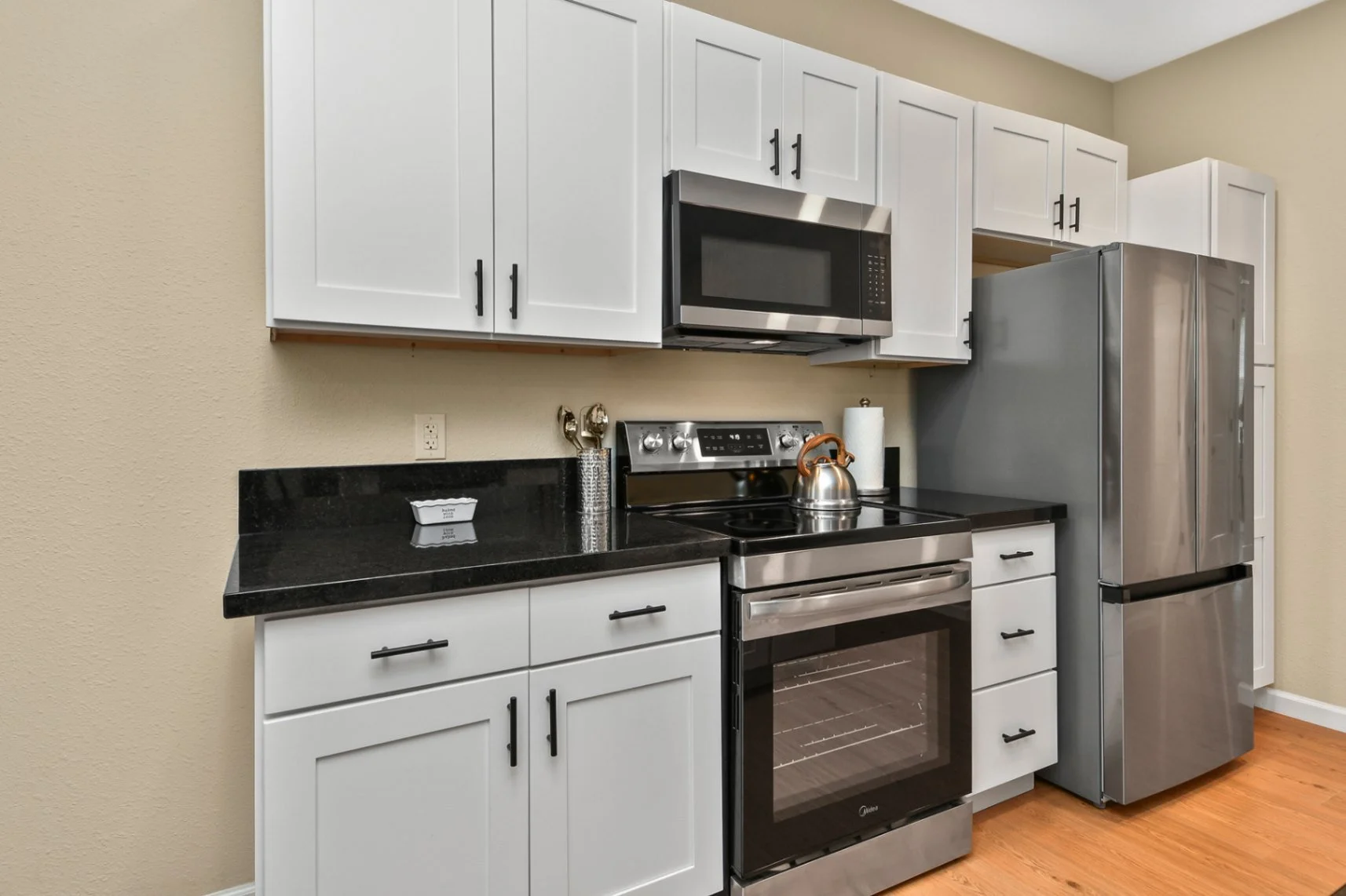 Kitchen Stainless Steel Appliances Granite Countertops Stove Microwave Fridge