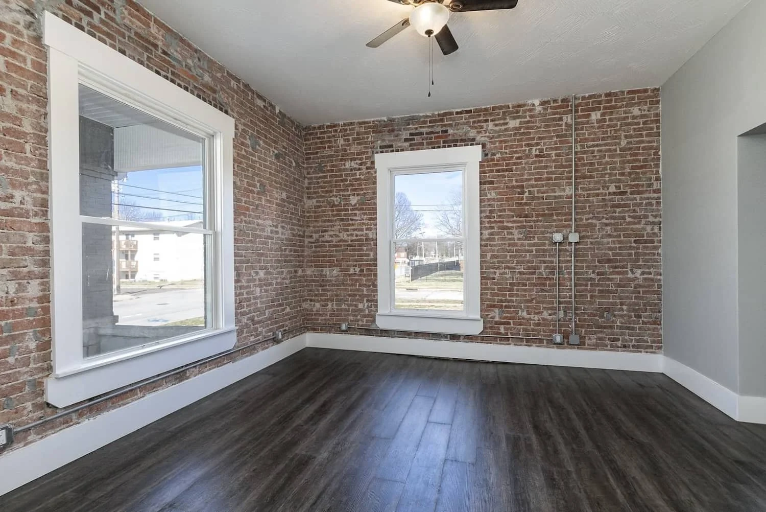 Downtown loft apartment for rent in springfield mo student housing MSU apartment 1 Apt 1 living room hardwood floors.jpg