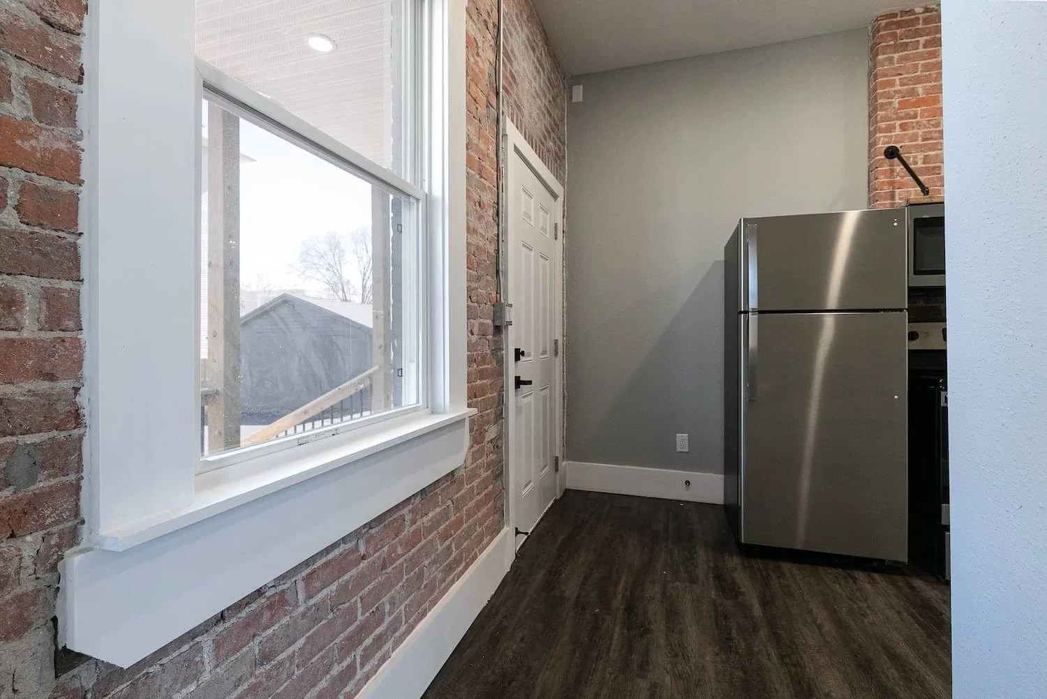 Student Housing MSU campus springfield mo downtown loft apartment for rent 1 bedroom first floor windows and exposed brick walls.jpg