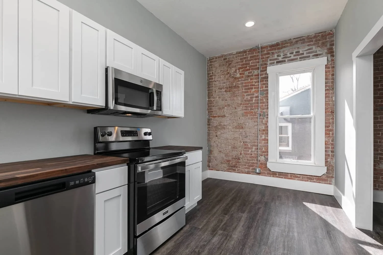 downtown loft apartment for rent in springfield mo apartment 3 new kitchen stainless steel appliances microwave stove dishwasher.jpg