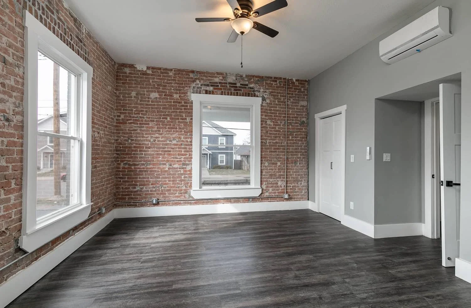 downtown loft apartment for rent in springfield mo apartment 3 exposed brick walls ceiling fans bay windows.jpg