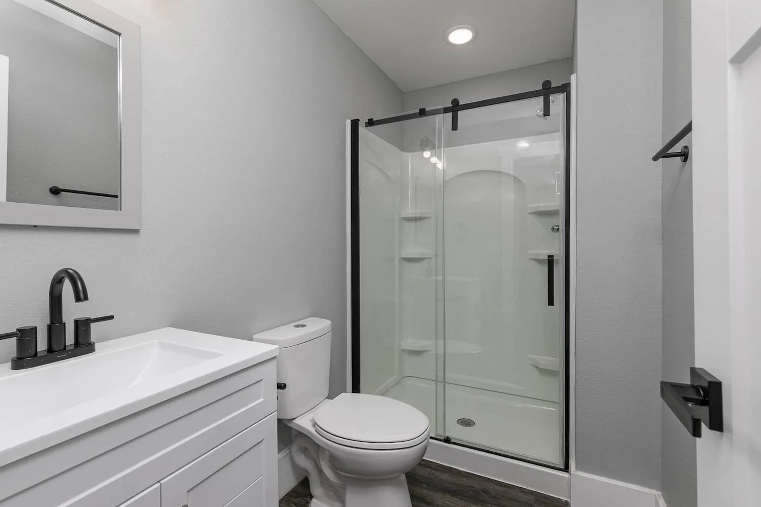 downtown loft apartment for rent in springfield mo new bathroom with glass shower.jpg