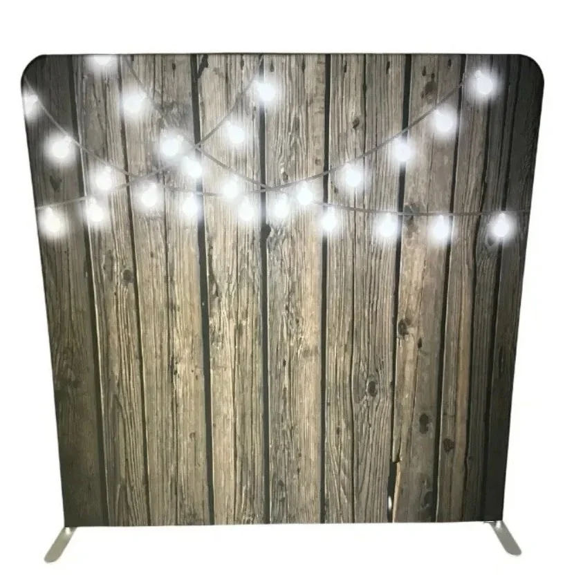 Wooden backdrop with string lights hanging across.