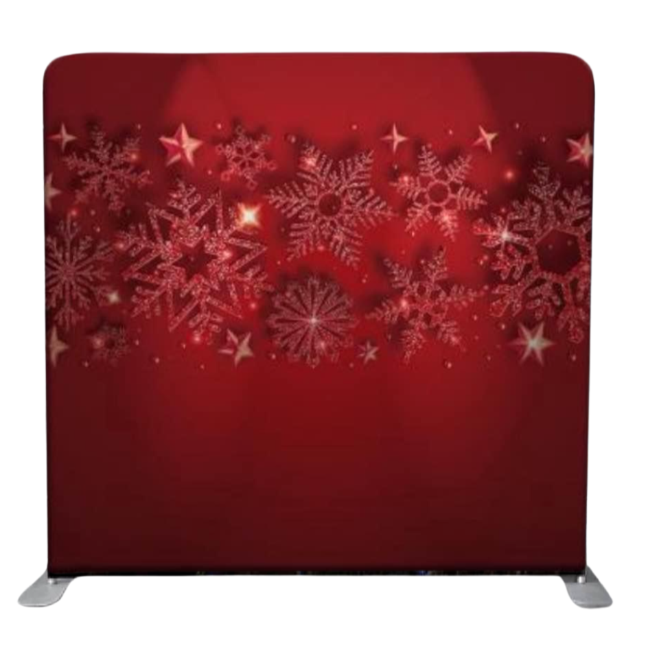 Red panel decorated with white snowflakes and star patterns, likely for the Christmas holiday season.