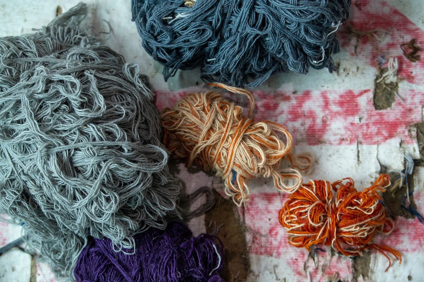 THE PRIMORDIAL PALETTE 
An abstract study of raw possibility. These hanks of unspun wool, rich in natural oils and earth-toned dyes, offer a "Designer Texture" that appeals to the architectural eye. It celebrates the "Refined Authenticity" of materia