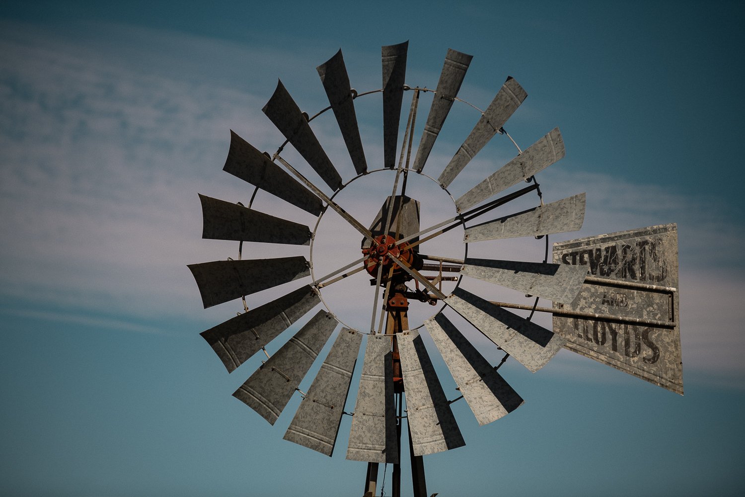 THE ANCIENT ROTOR
The ultimate symbol of Karoo resilience. This skeletal windmill stands as a sentinel against the arid sky—a study in "Ancient Equilibrium." Rendered with high-contrast precision, it brings a sense of historical power and "Grounded E