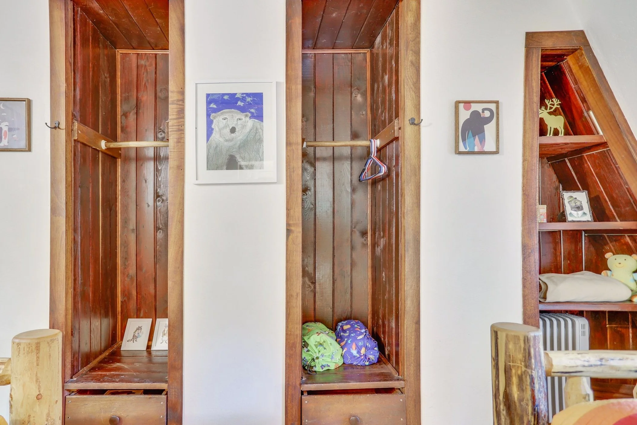 Playful art, sleeping bags and trinkets adorn the closets, inspiring wonder and joy.