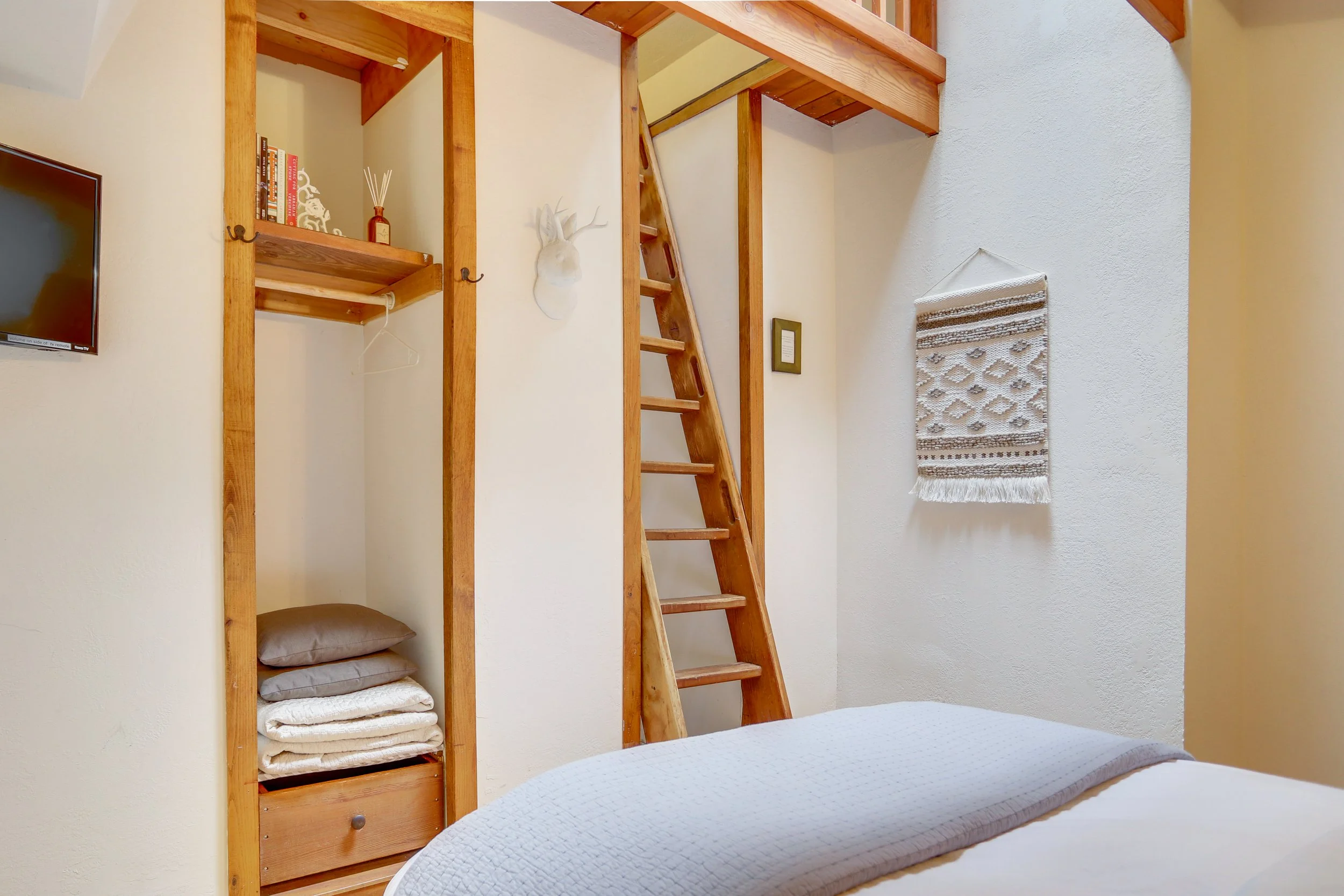 A ladder takes smaller guests to a loft, while a closet and Roku TV offer all the features of home while you're away.