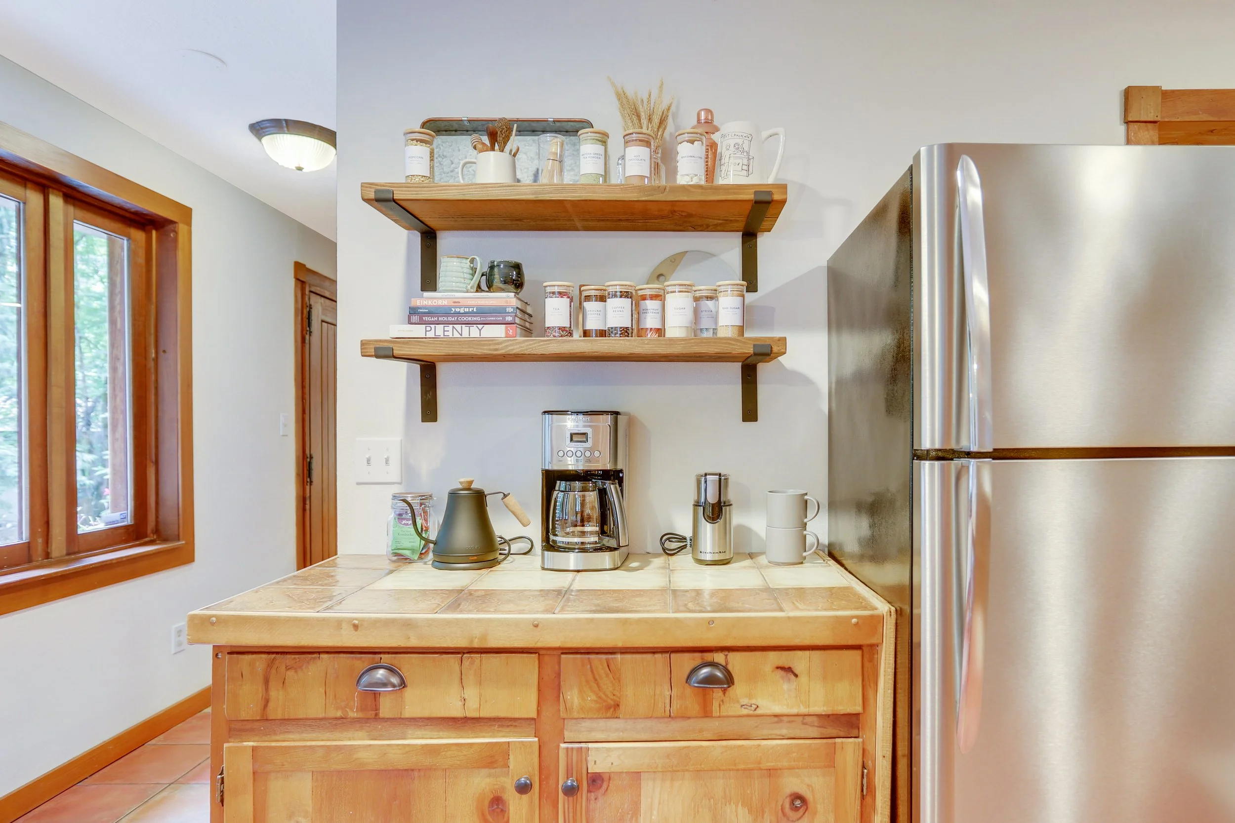 Coffee and tea bar includes sweet extras like an electric kettle, french press, beans, teas, homemade hot cocoa mix and marshmallows.