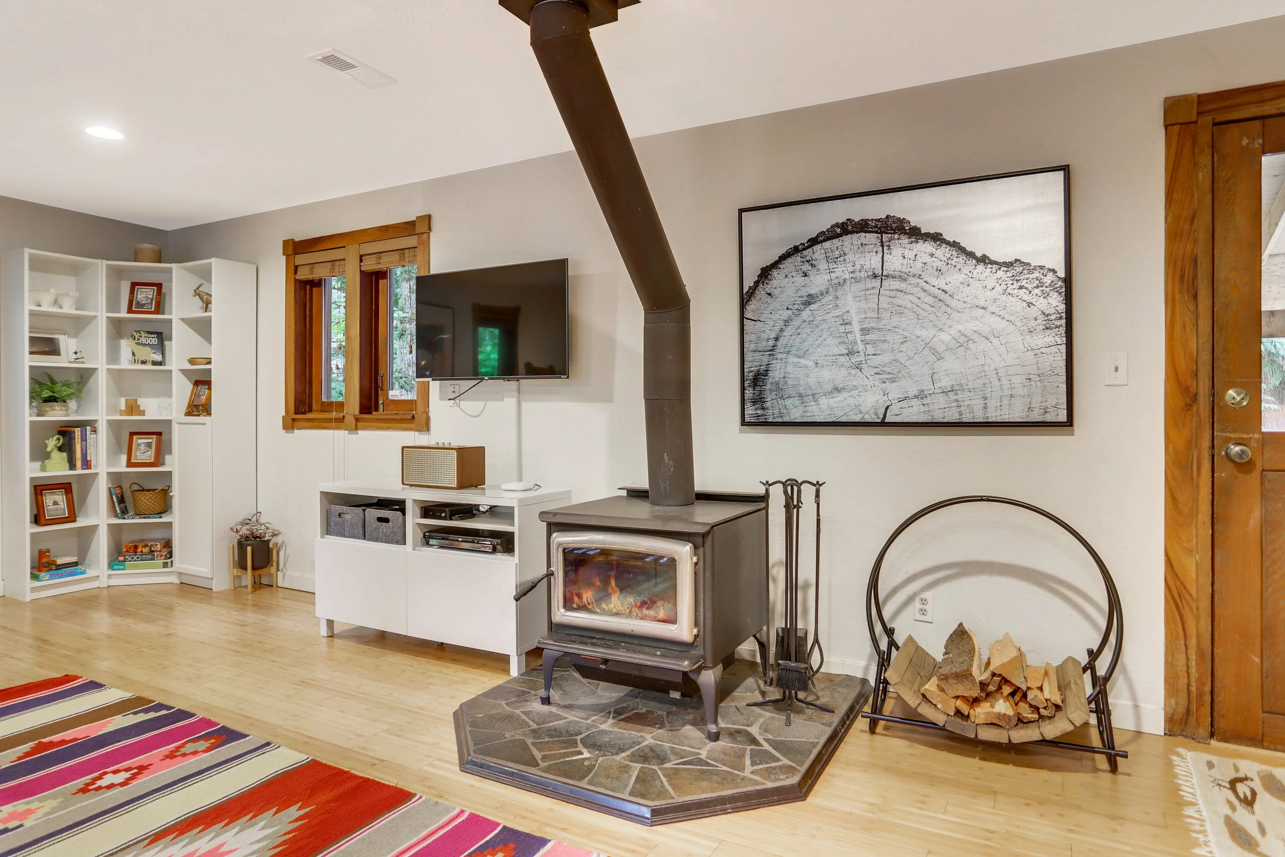 A wood-burning stove, smart TV and wifi complete the modern, mountain cabin vibe.