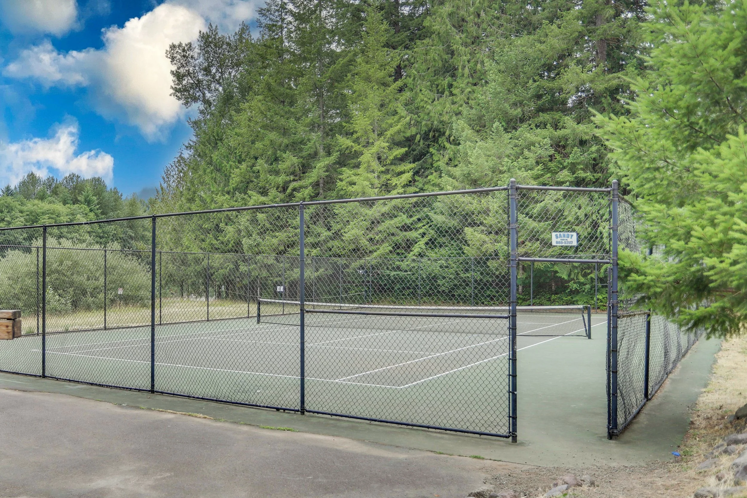 A full-size tennis and basketball court flank the north and south sides of the community clubhouse. Bring your gear, and it's game on!