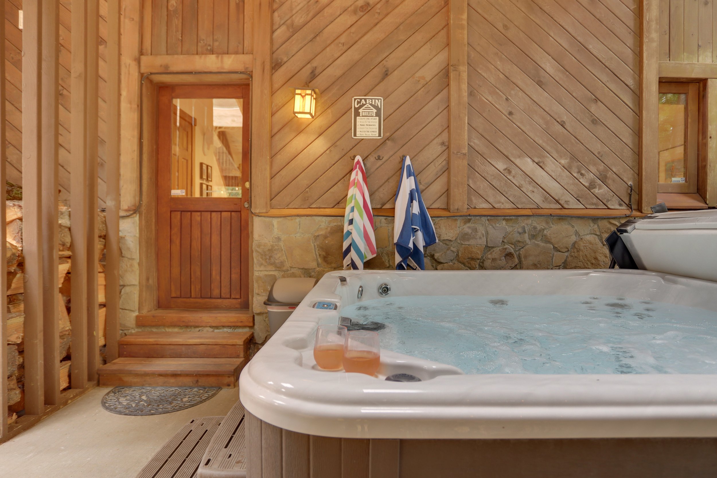 This pristinely maintained hot tub is your go-to spot after a big day. Perfectly situated under a covered patio with a skylight directly overhead.