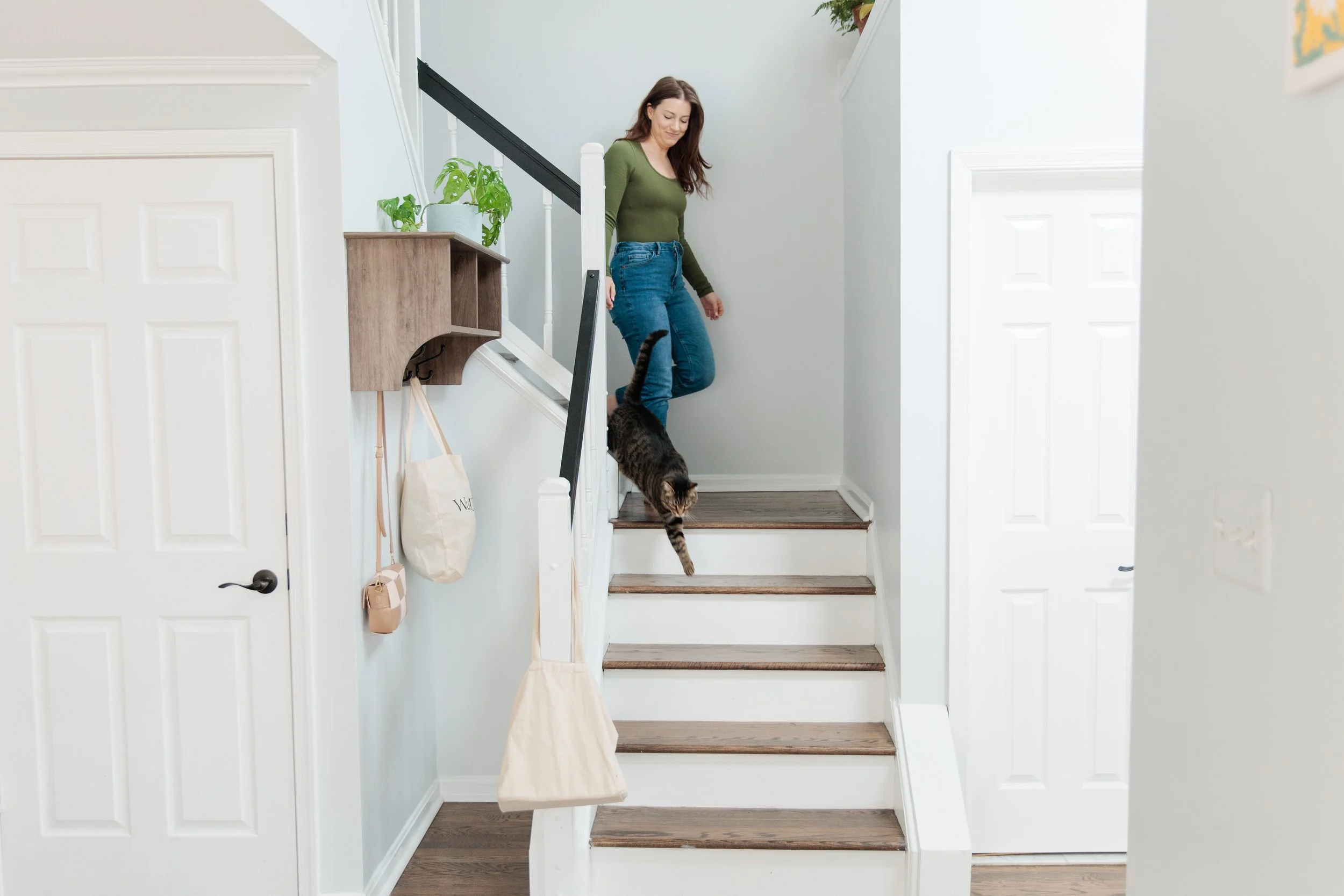 Therapist for panic attacks walking down stairs in therapy office in Reston, VA